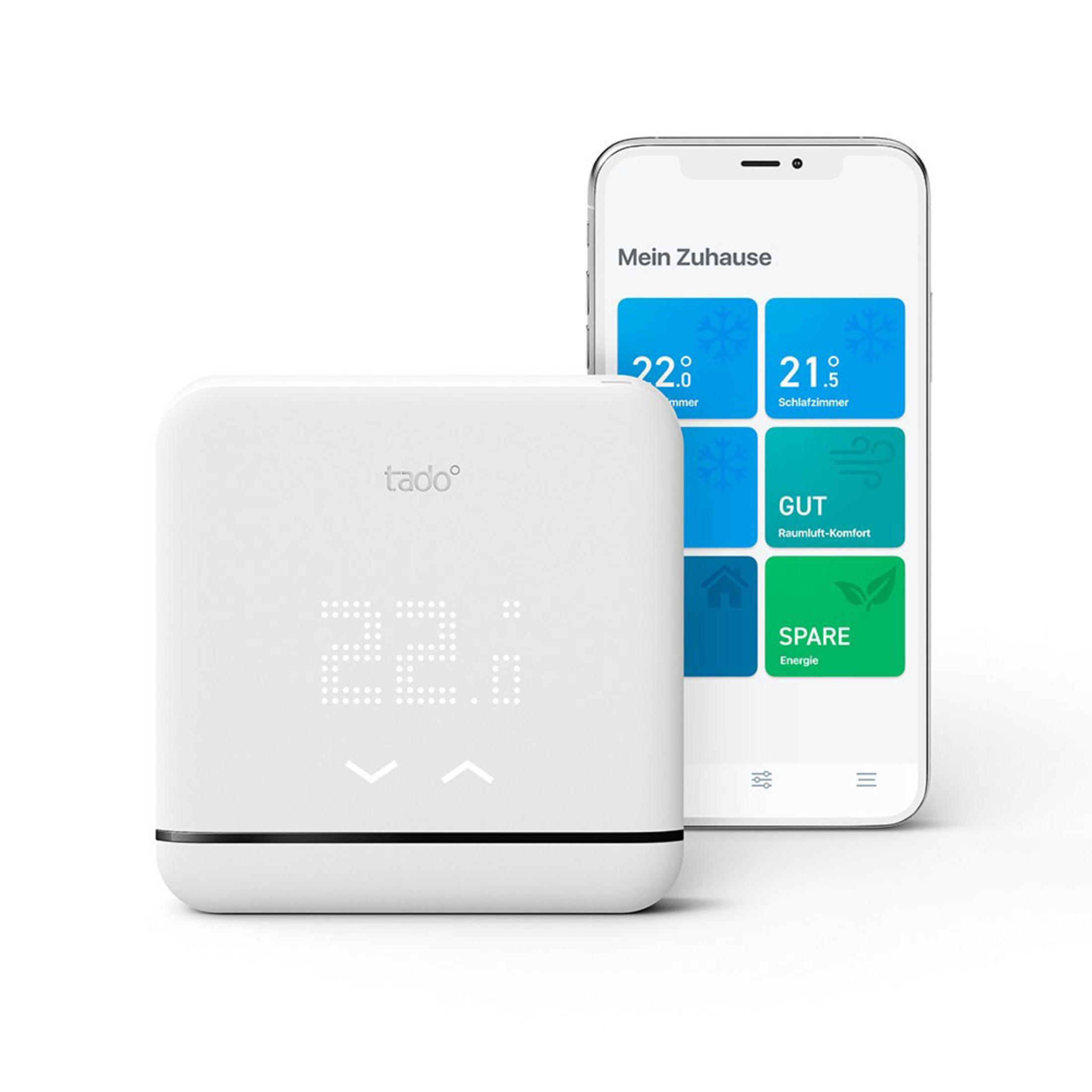 A white smart thermostat and a smartphone displaying a user interface with temperature settings.