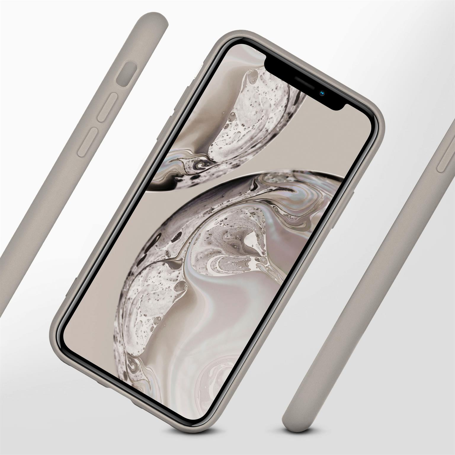 Telefon in grauem Gehäuse, abgewinkelt, mit umliegenden Gehäuseteilen.