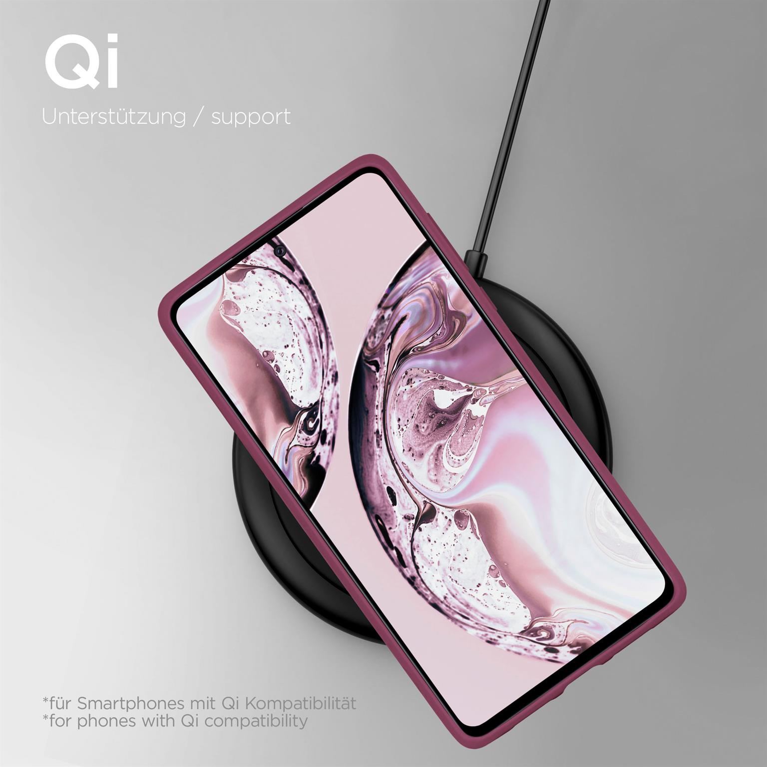 Ein Telefon auf einer Qi-Ladestation, eine Handyhülle in lila Farbe. Text: Qi-Unterstützung.