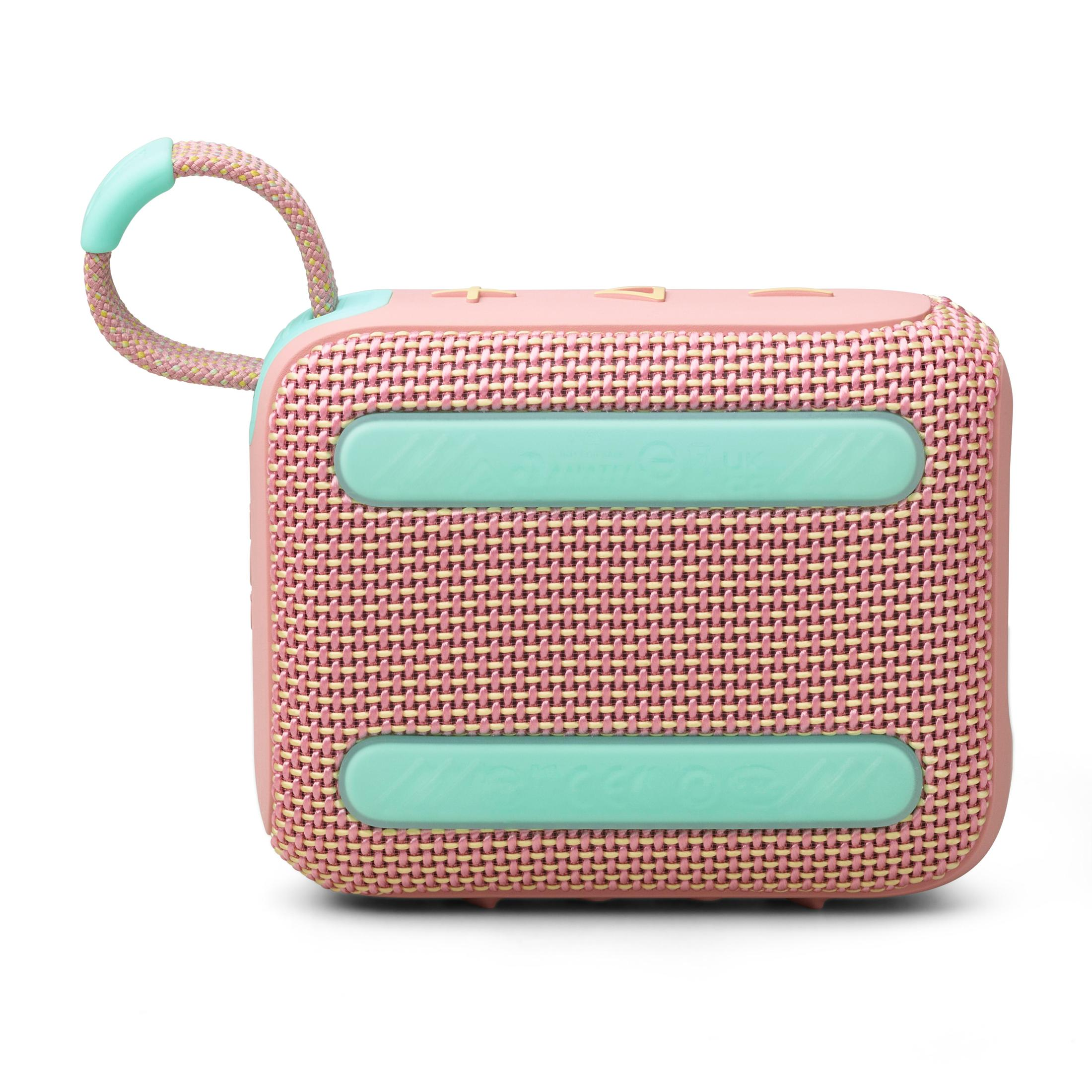 Pink and mint green portable speaker with a braided handle. White background.
