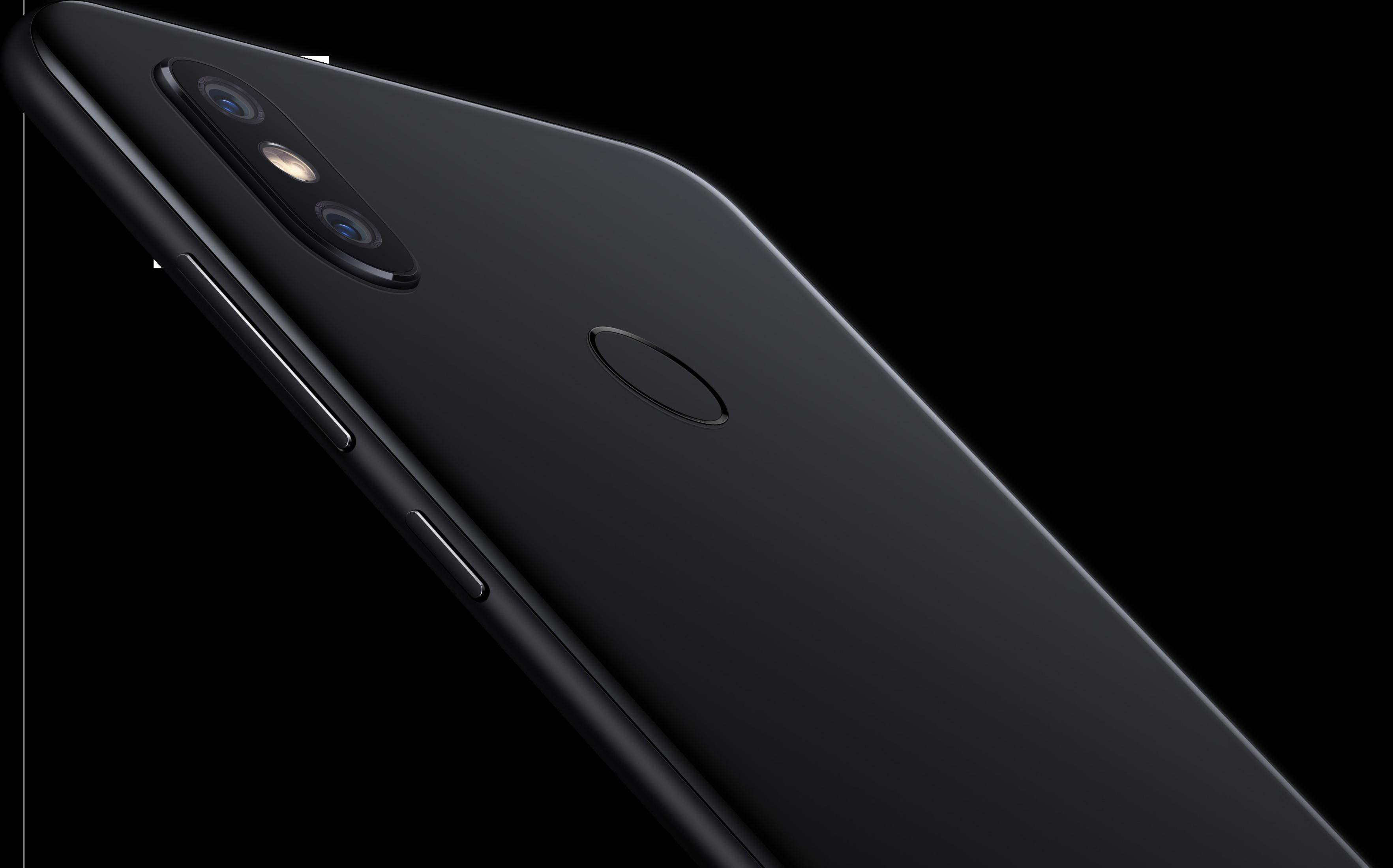 Schwarze Smartphone-Rückseite. Kameralinsen und Fingerabdrucksensor sichtbar. Dunkler Hintergrund.