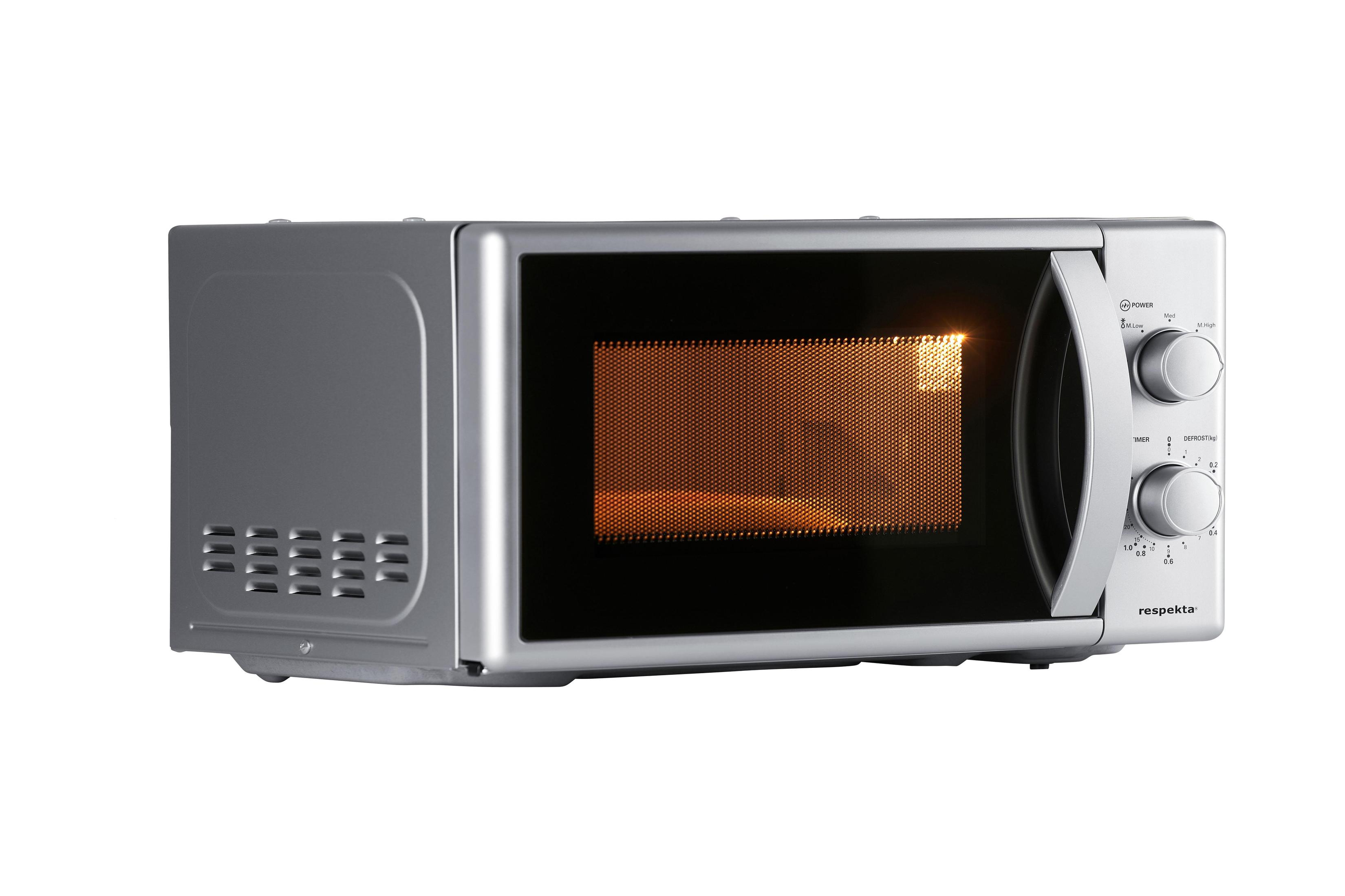 Silver microwave oven with open door. Interior lit, with control knobs on the right.