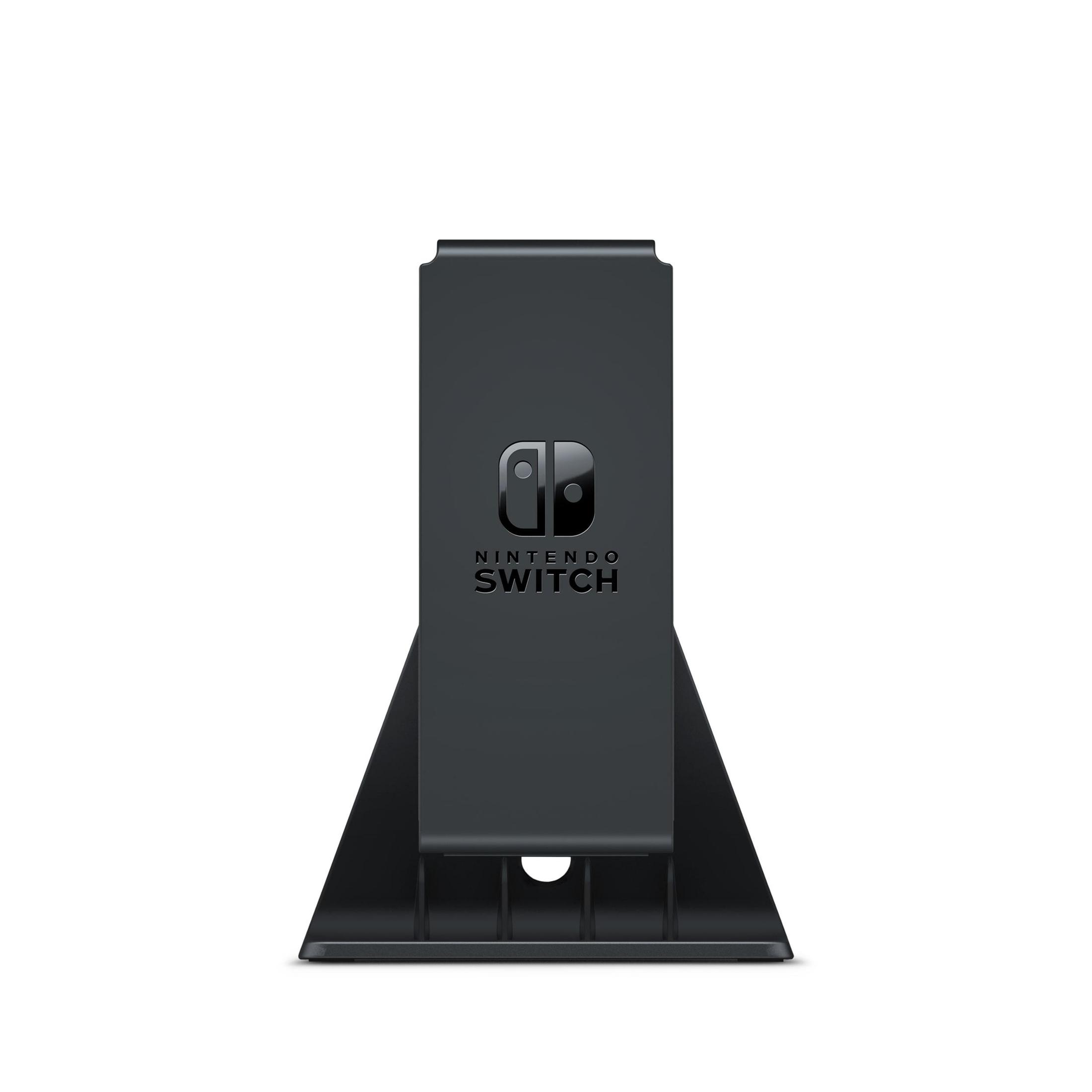 Una stazione di aggancio Nintendo Switch nera è in posizione verticale, mostrando il logo.