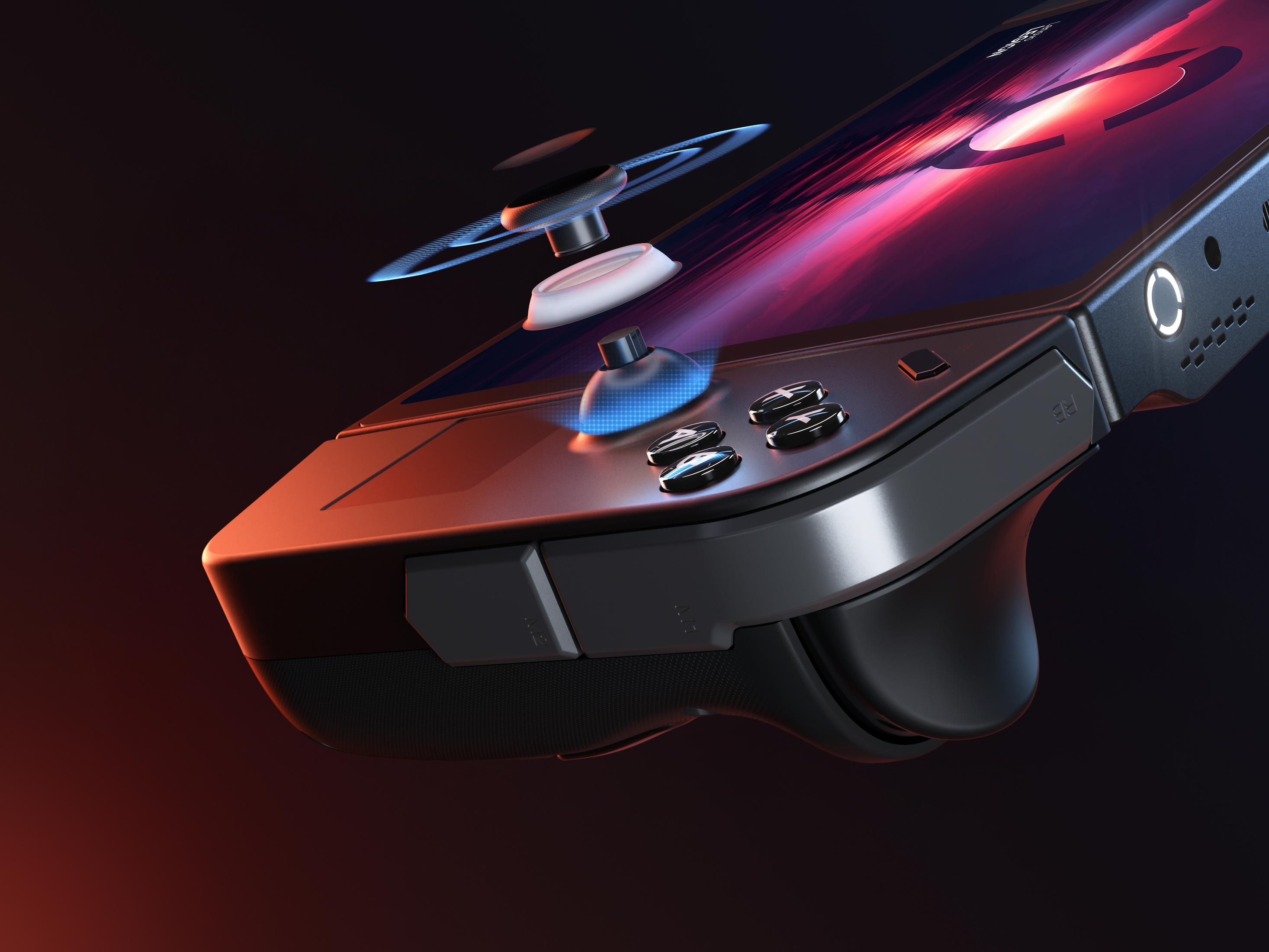 Primo piano di un dispositivo di gioco. Ha pulsanti e un joystick blu. Sfondo scuro.