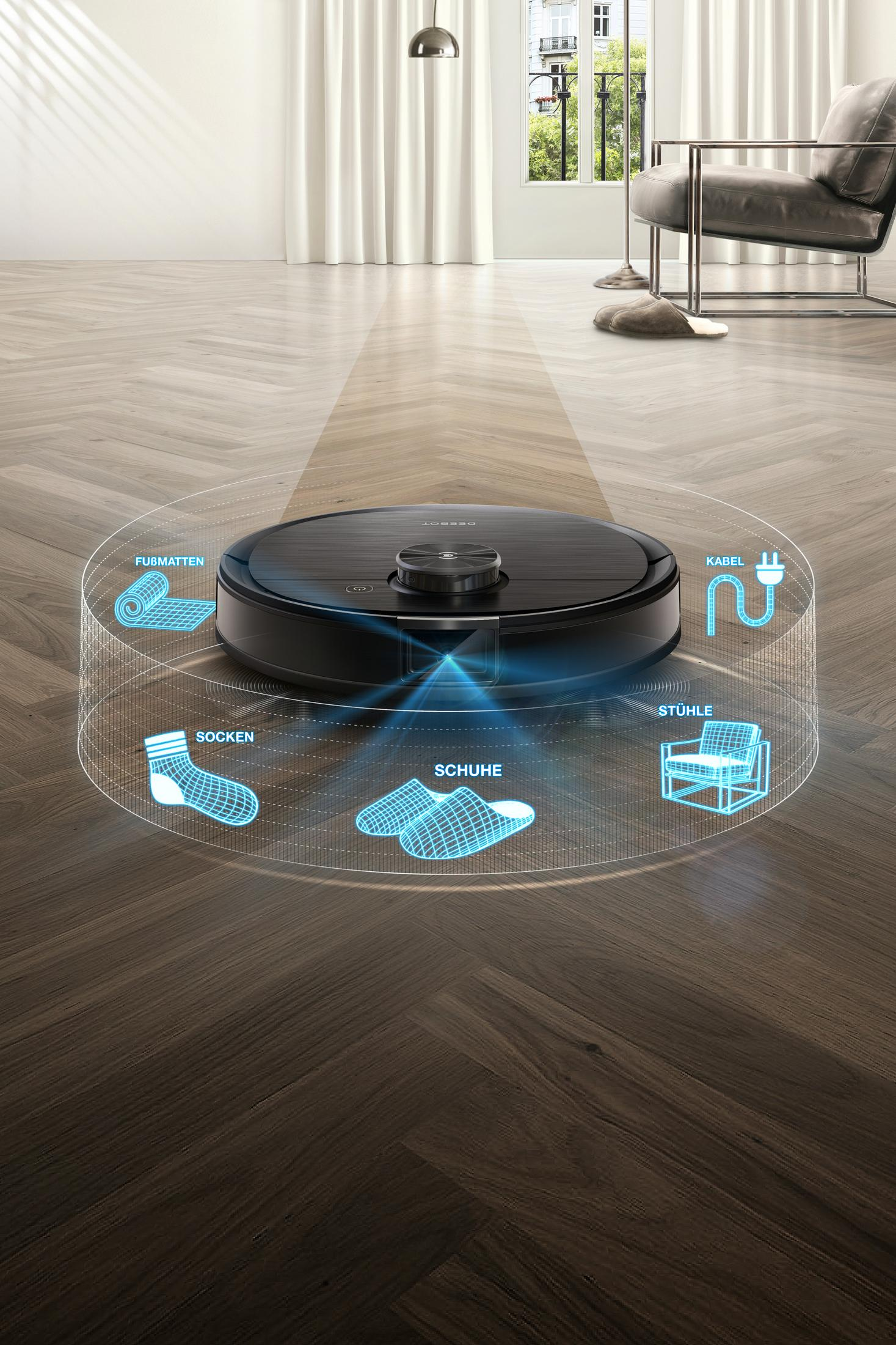 Ein schwarzer Roboter-Staubsauger auf einem Holzboden mit Grafiken von Reinigungsbereichen.