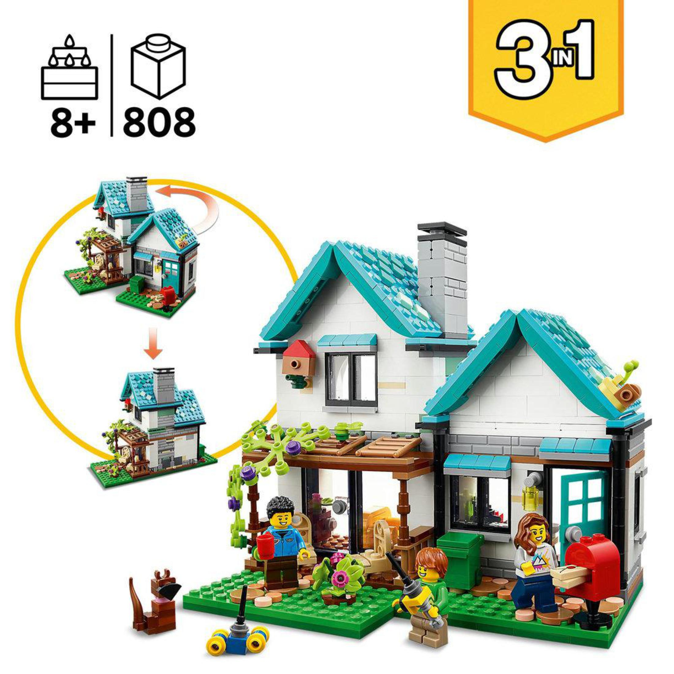 Set di case Lego con figure. Prato verde, tetto blu, muri bianchi e molti piccoli dettagli.