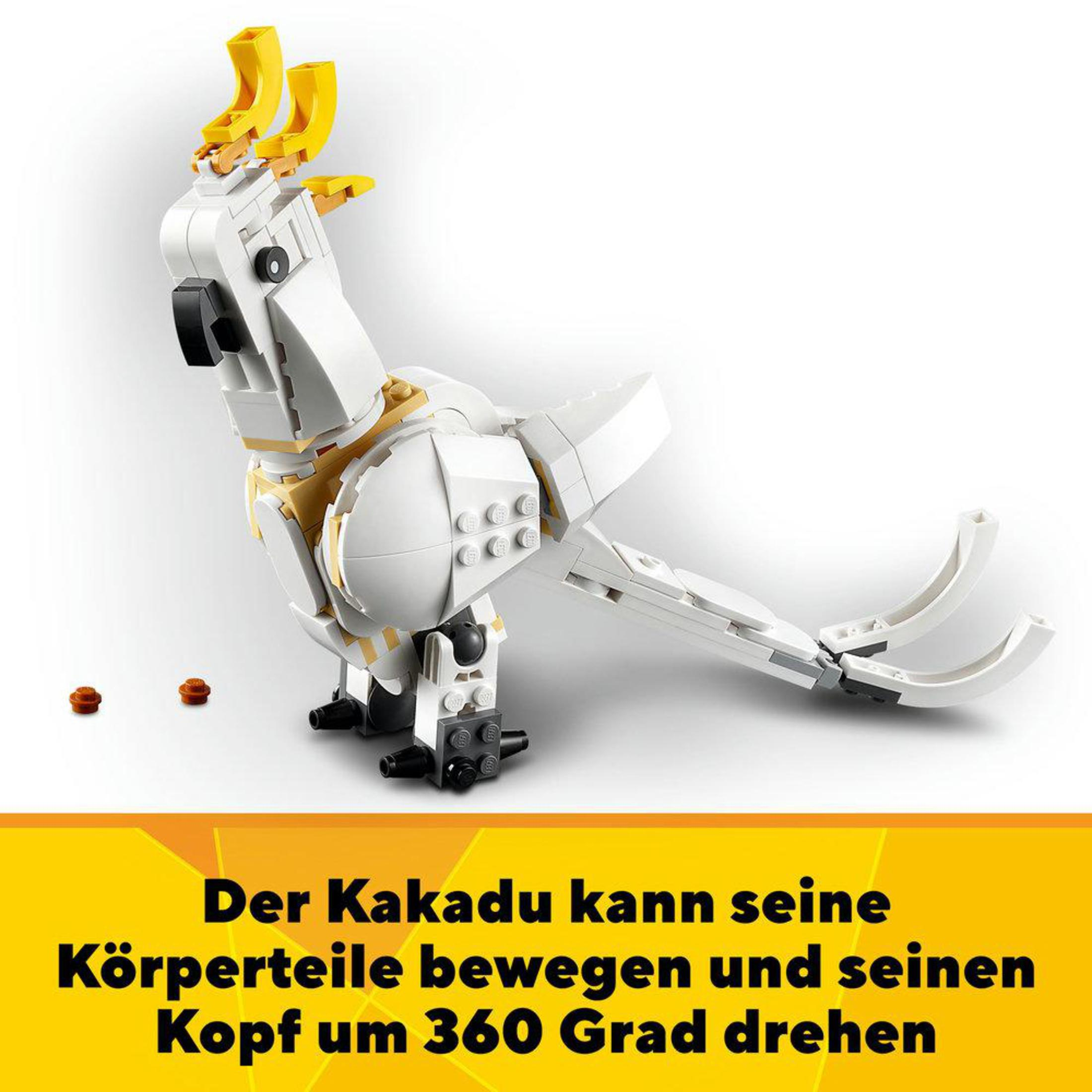 Ein Lego Papageienmodell in Weiß und Gelb, mit deutschem Text.