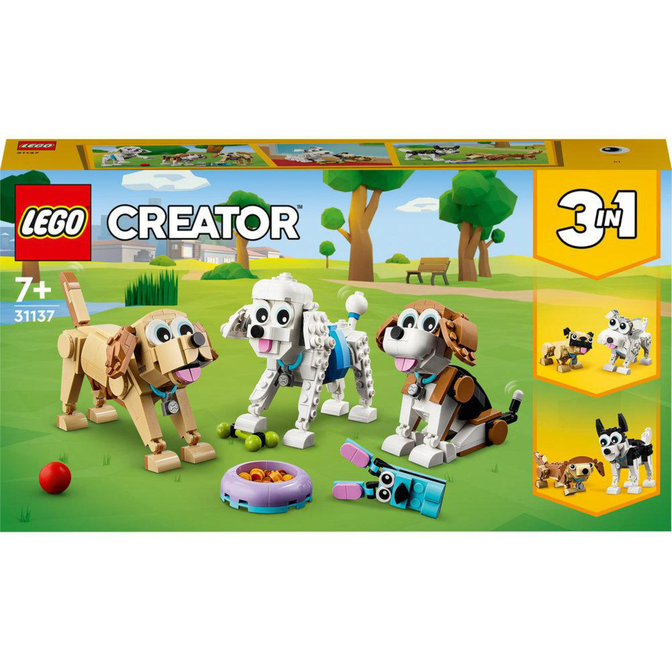 Een Lego doos met drie Lego honden en een paar accessoires. Witte achtergrond.
