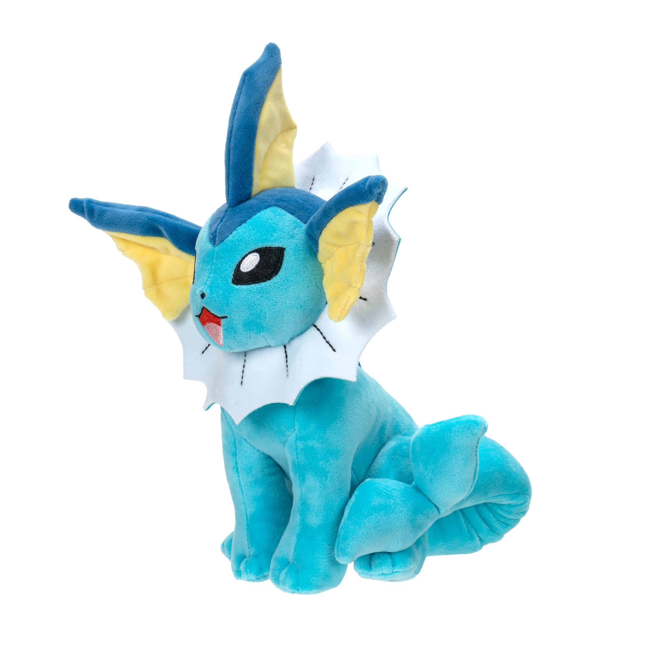 Ein türkisfarbenes Vaporeon-Plüschtier, das sitzt, mit dem Kopf gedreht und einem weißen Kragen.