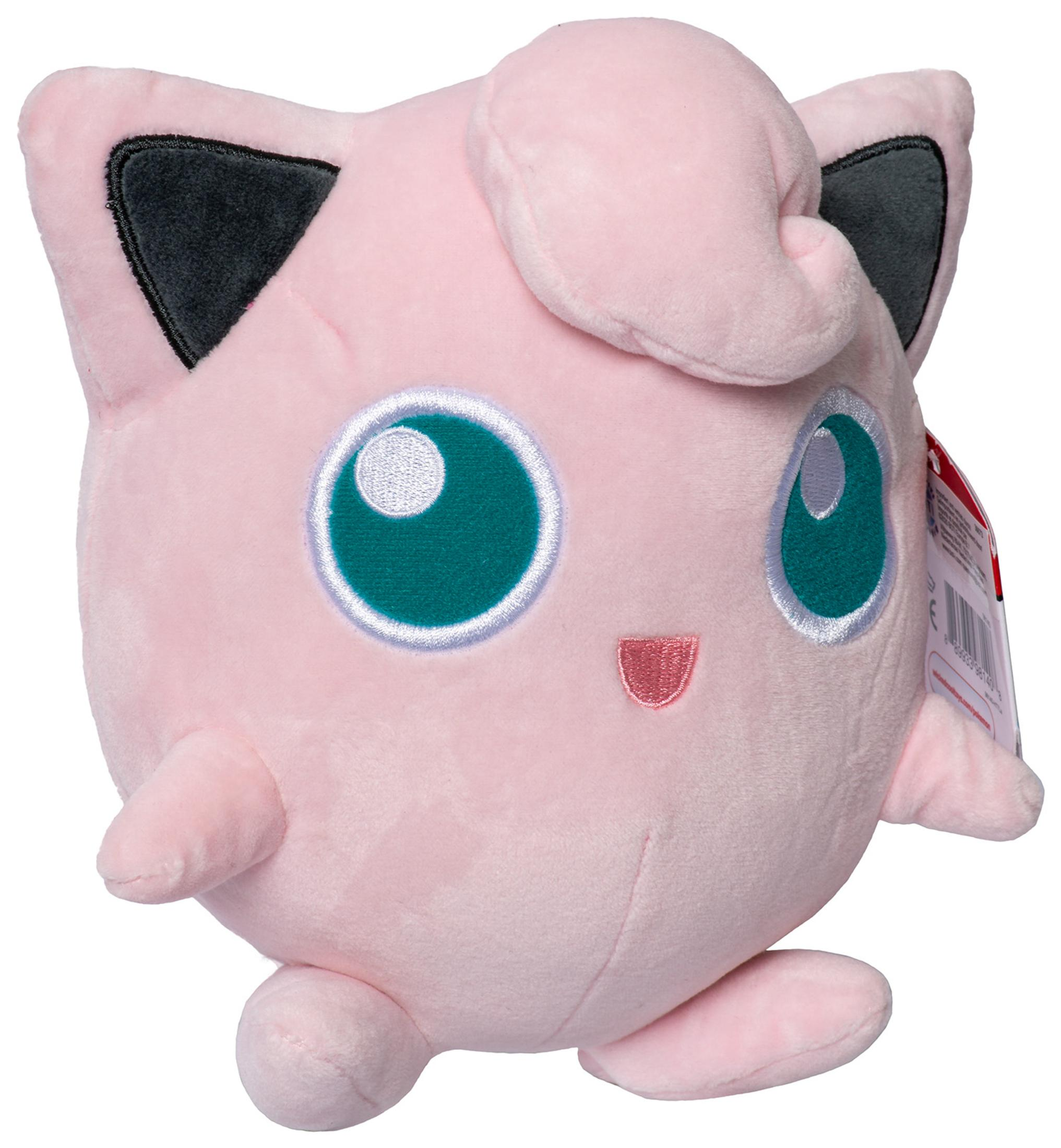 Rosa Jigglypuff-Plüschtier. Es hat grüne Augen und einen kleinen Mund. Weißer Hintergrund.