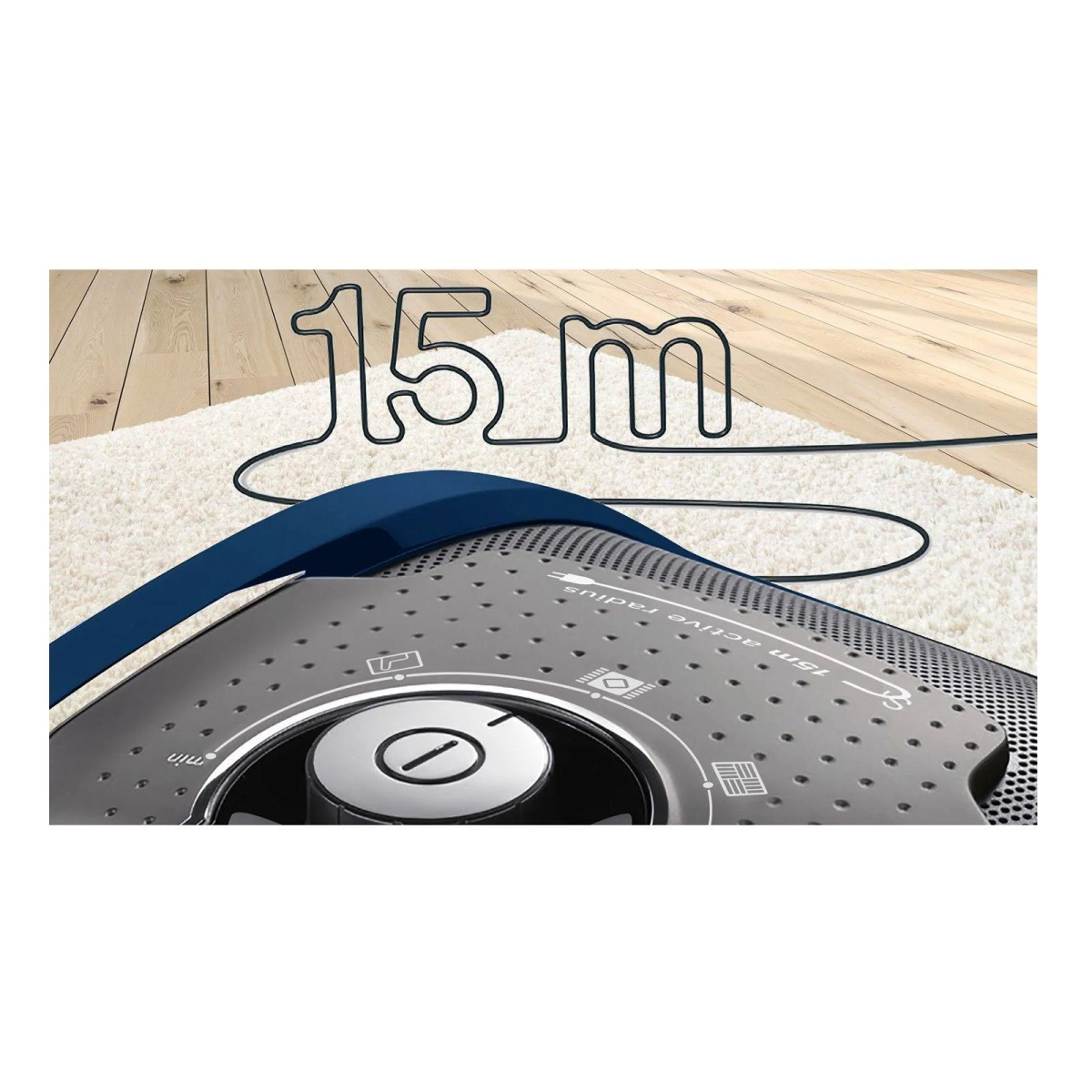 Odkurzacz z symbolem promienia 15 m na białym dywanie i niebieskim uchwytem.