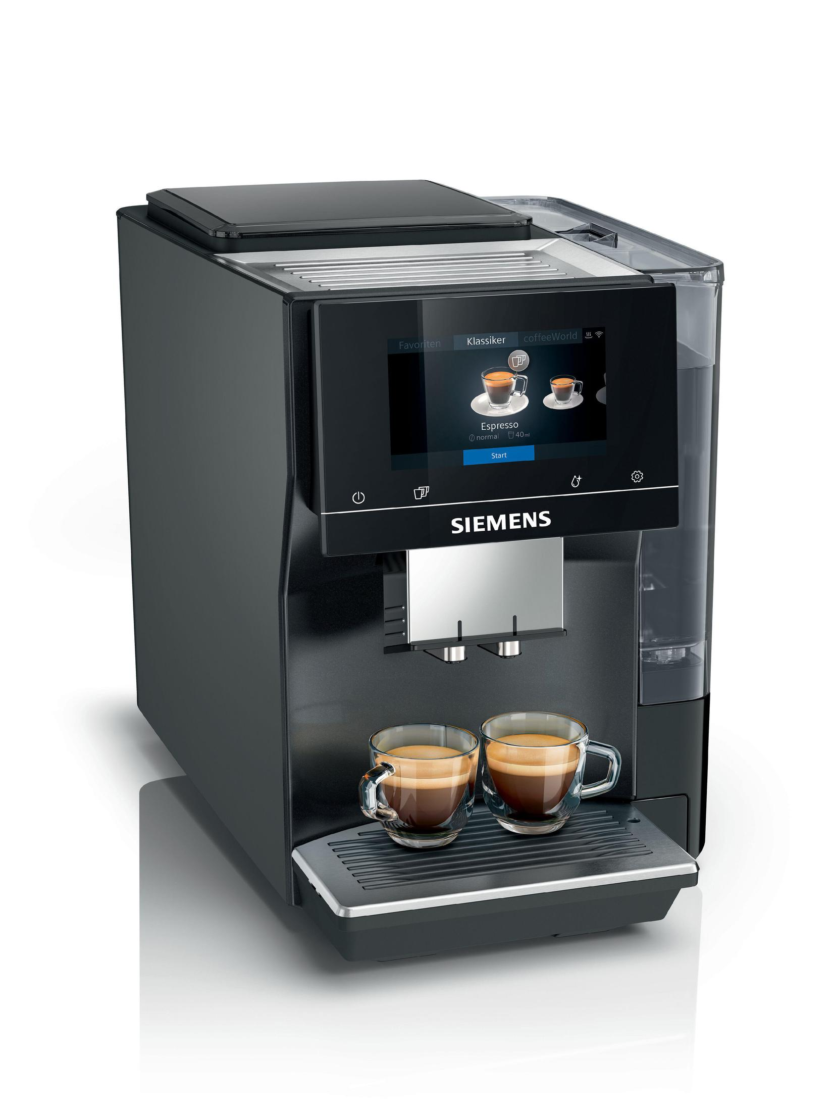 Siemens Kaffeemaschine. Zwei Tassen Kaffee auf dem Tablett. Schwarze Maschine auf weißem Hintergrund.