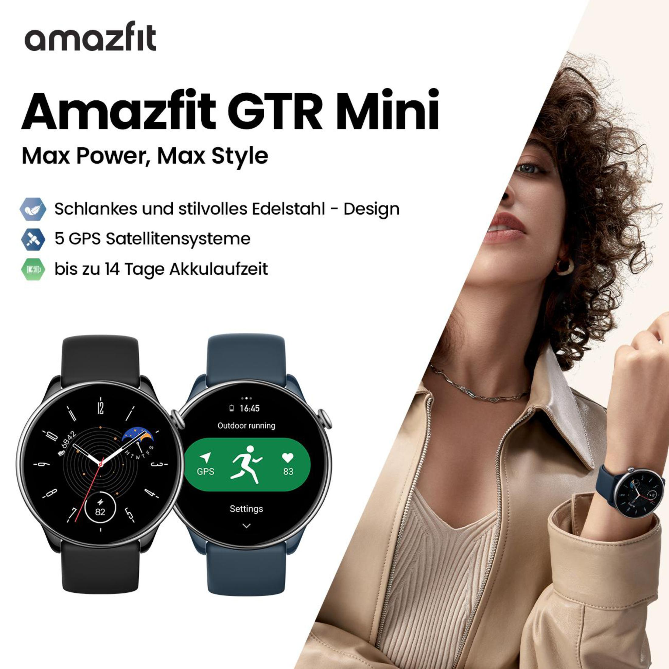 Due smartwatch, uno nero e uno blu, su uno sfondo promozionale. Una donna è nell'immagine.
