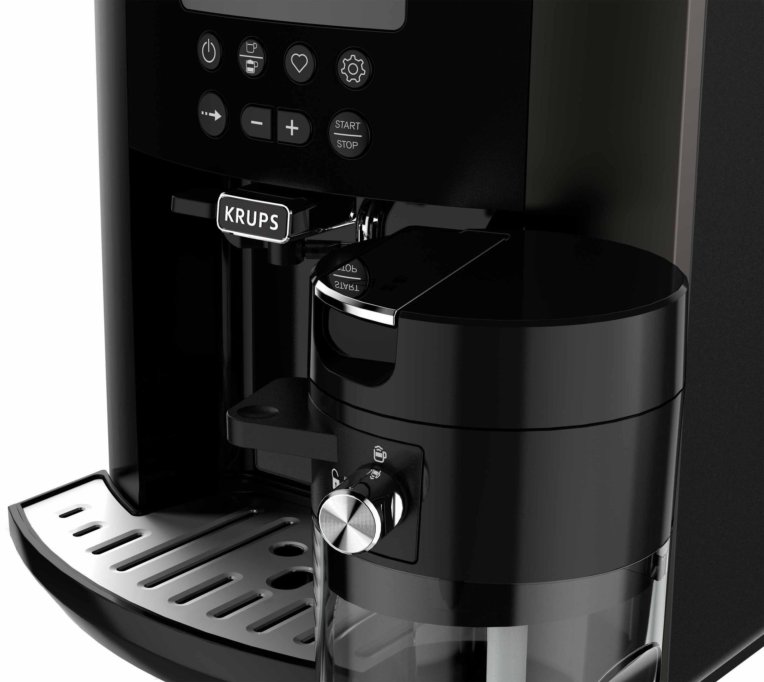 Primo piano di una macchina da caffè Krups nera, con serbatoio dell'acqua e pannello di controllo visibili.