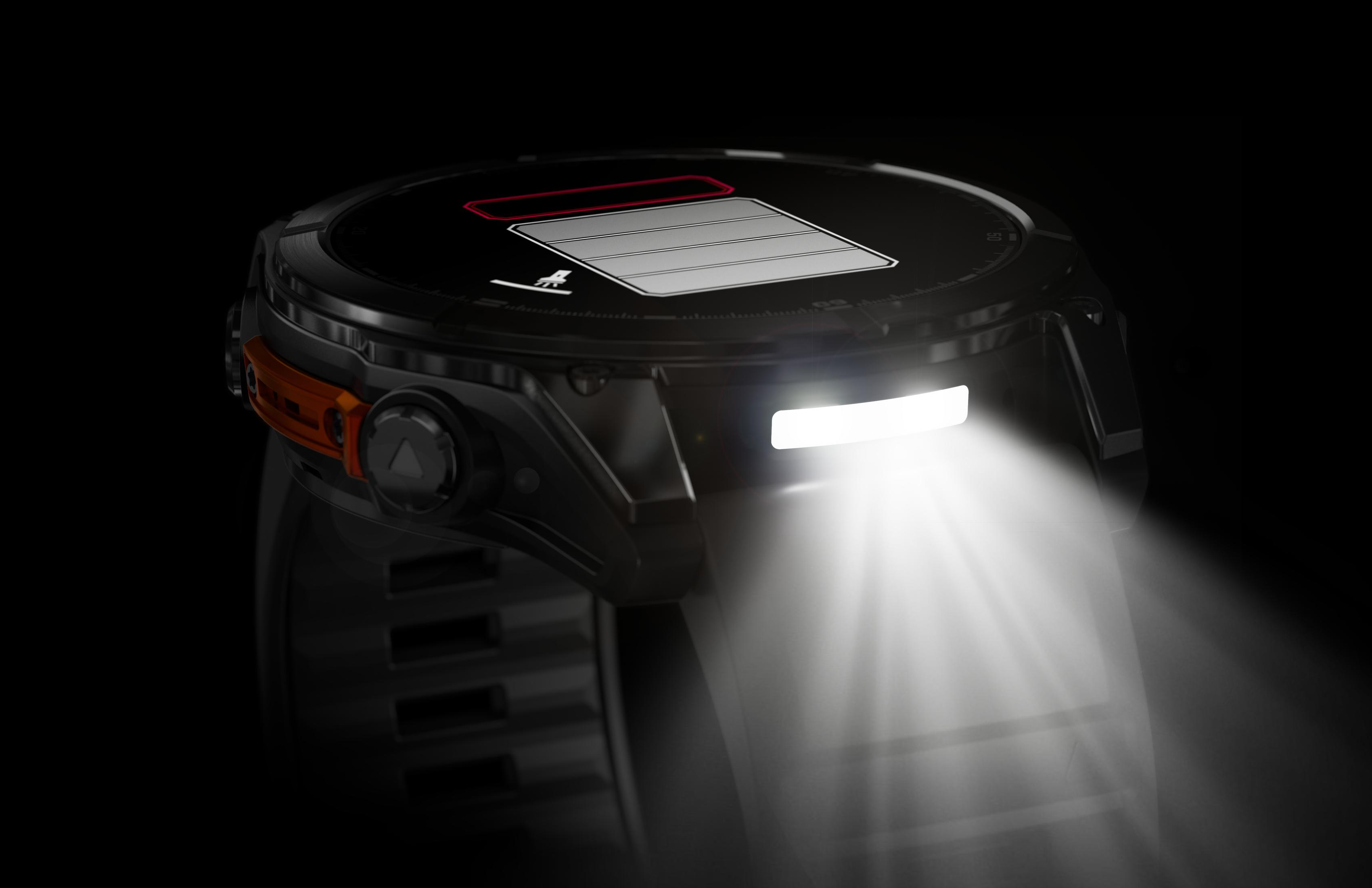 Un smartwatch negro con una luz brillante que emana de la parte superior.