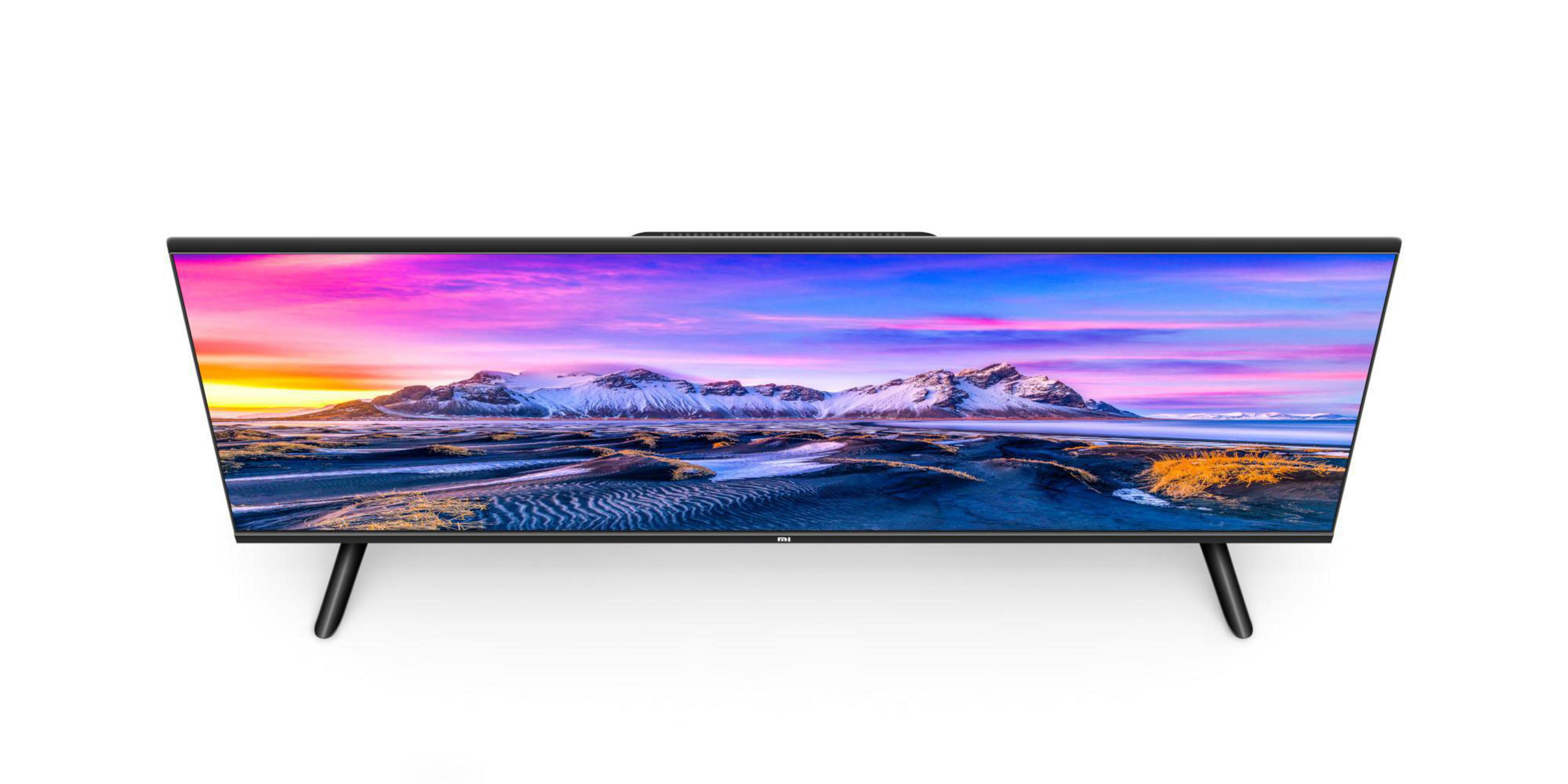 Bovenaanzicht van een tv met een kleurrijk landschap. De tv heeft zwarte poten en een frame.