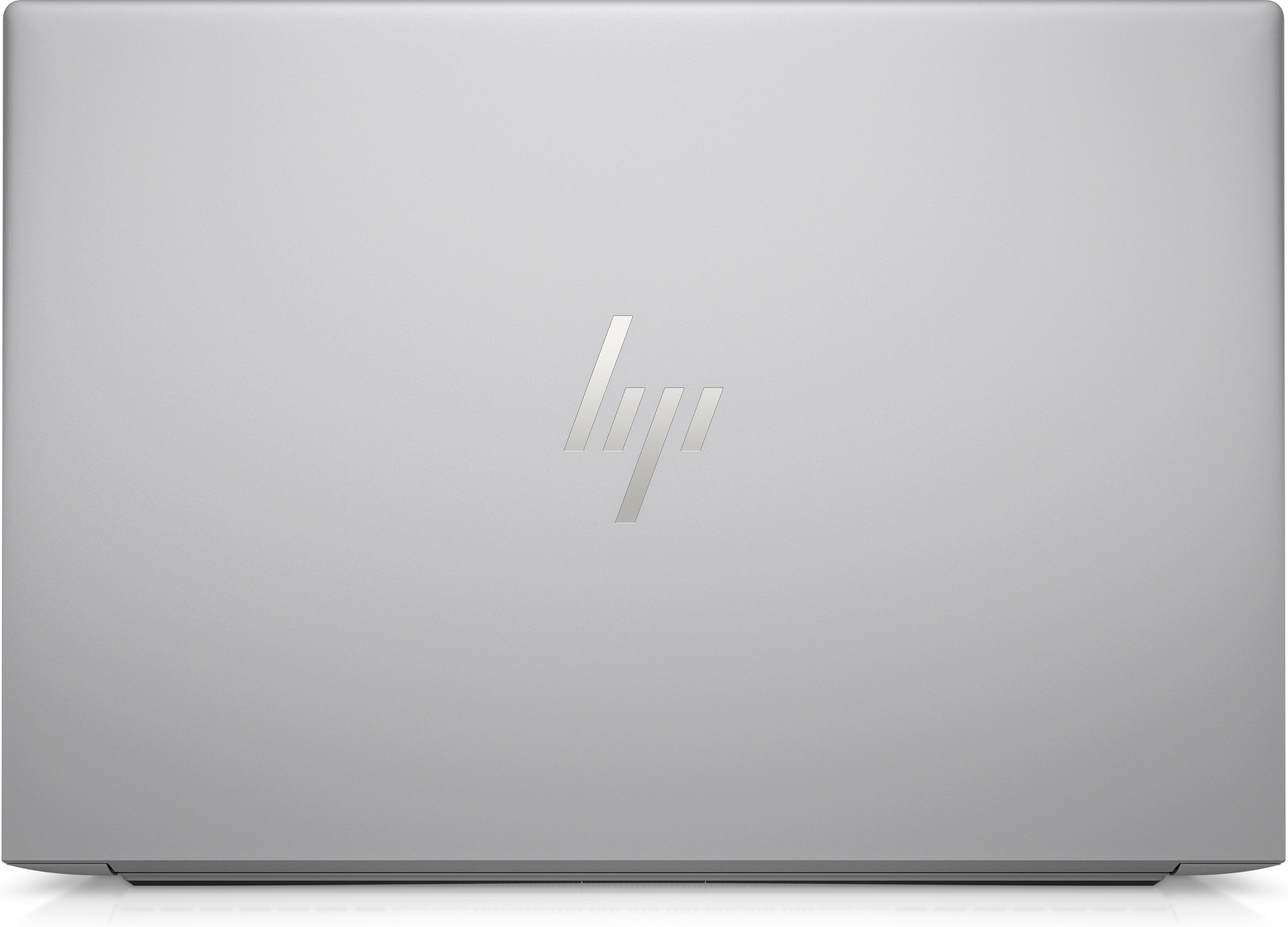Zamknięty, srebrny laptop z widocznym logo HP.