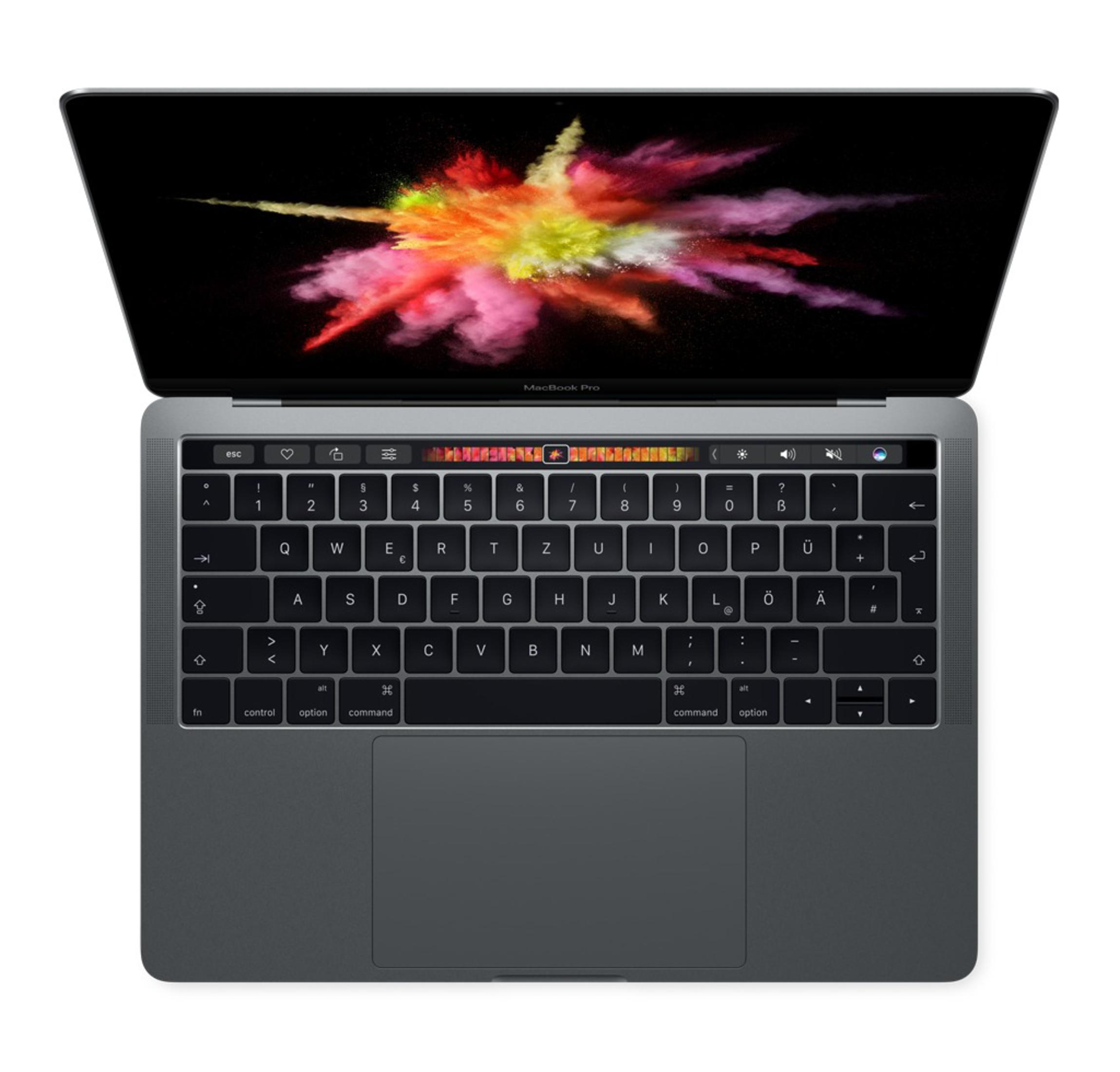 Laptop, Draufsicht, Tastatur und Bildschirm mit farbenfroher Explosion.