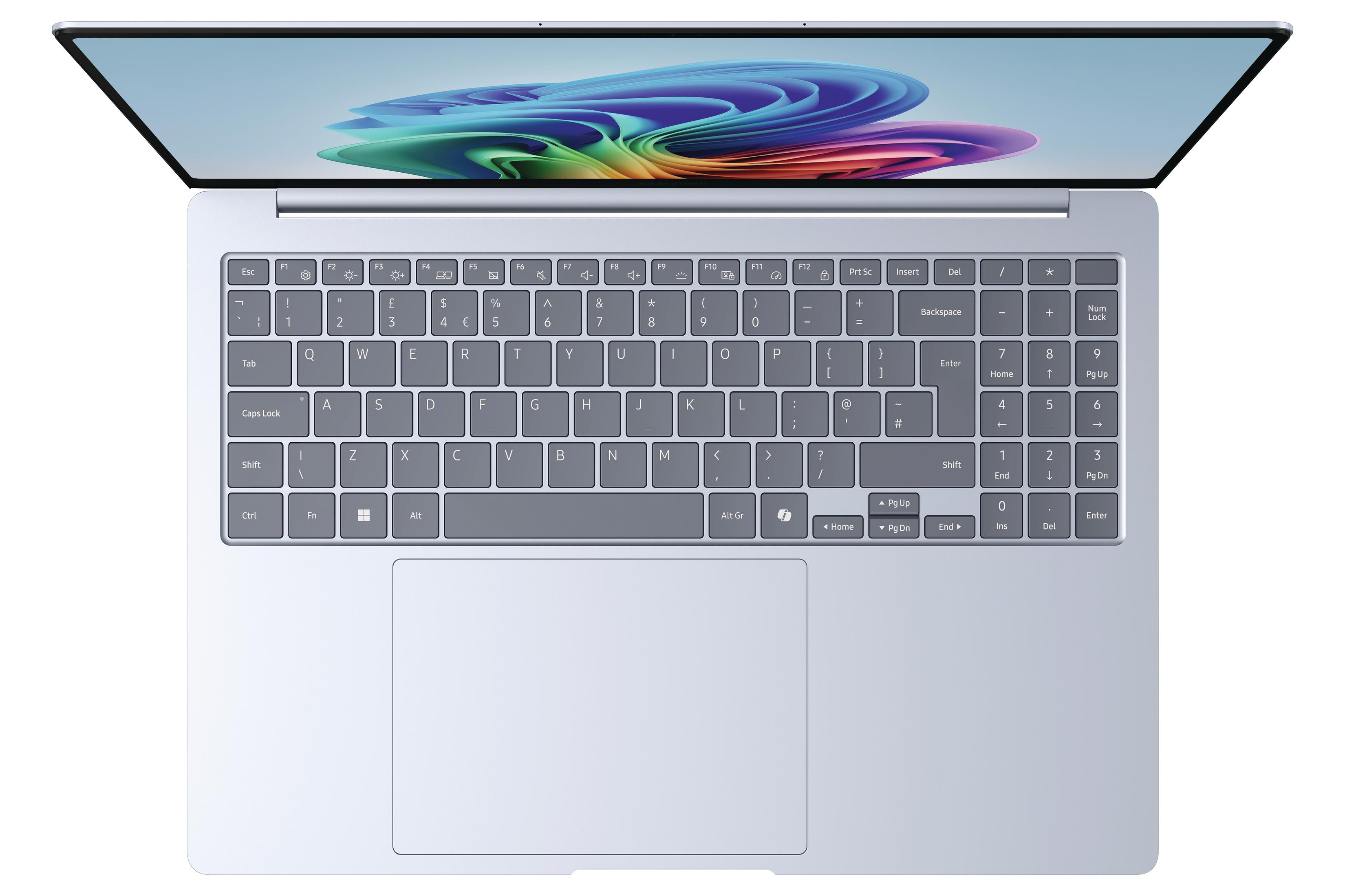 Jasnoniebieski laptop, widok z góry, widoczna klawiatura. Ekran pokazuje kolorowy design.