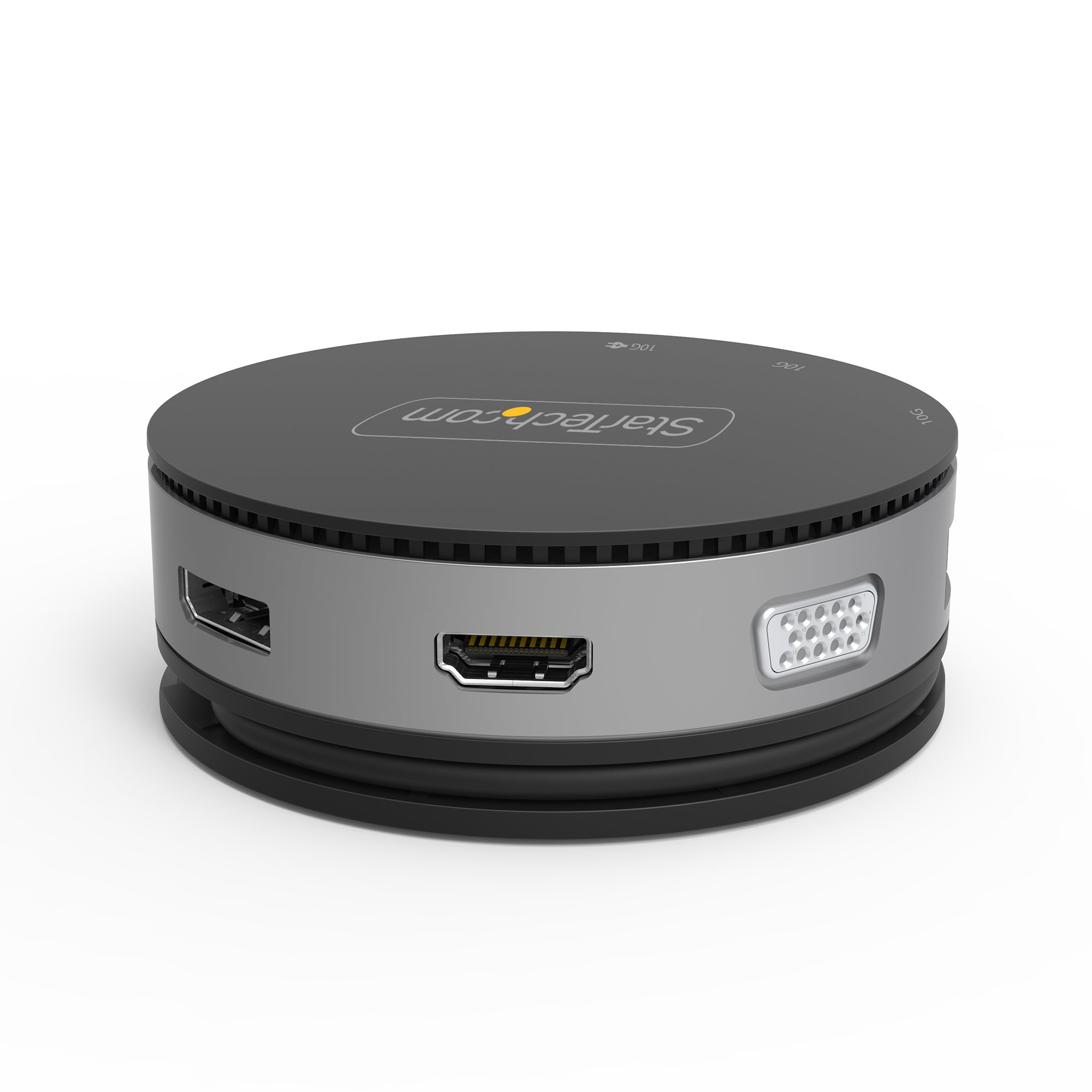 Runder schwarzer Hub mit Anschlüssen. Silberne Seiten. HDMI, USB und andere Anschlüsse sichtbar. Weißer Hintergrund.