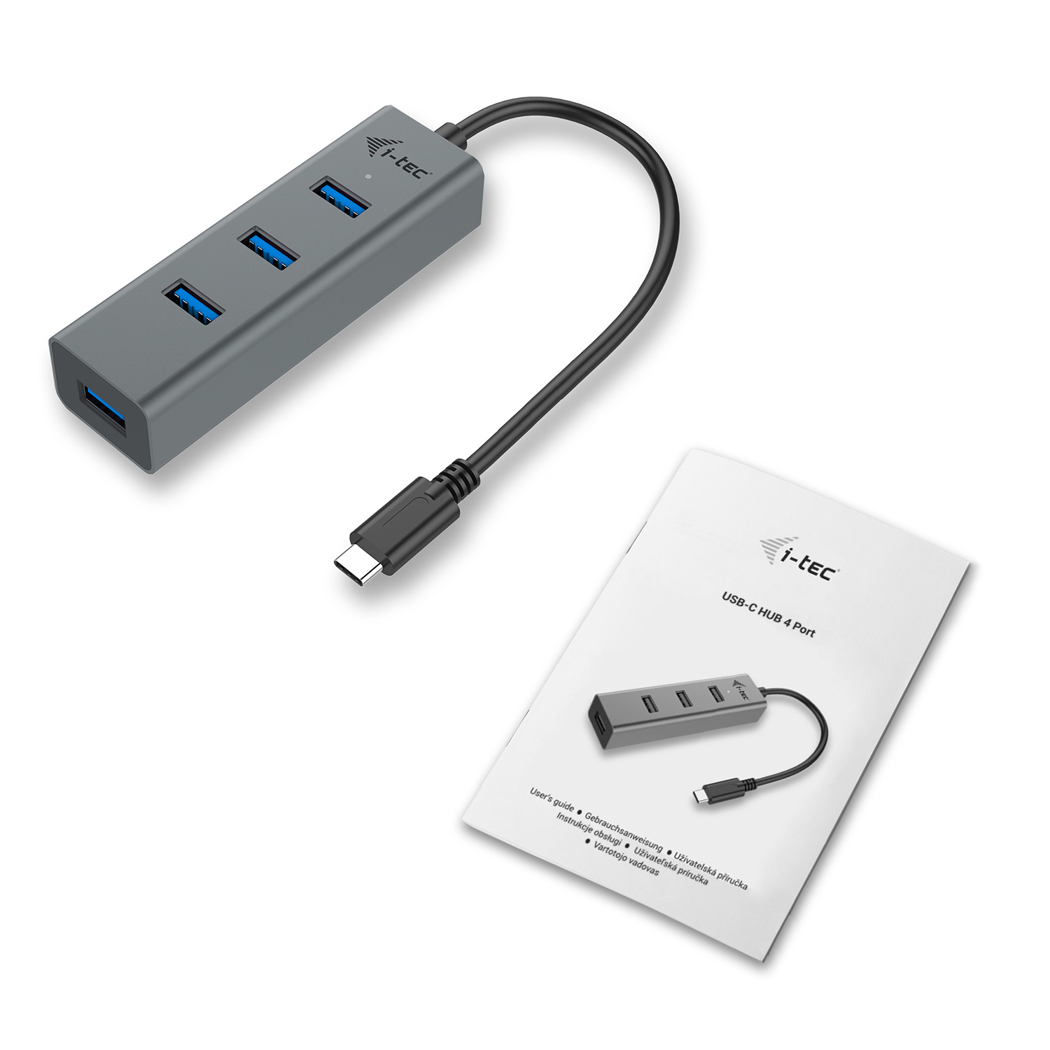 Concentrador USB-C gris con cable negro y manual blanco al lado.