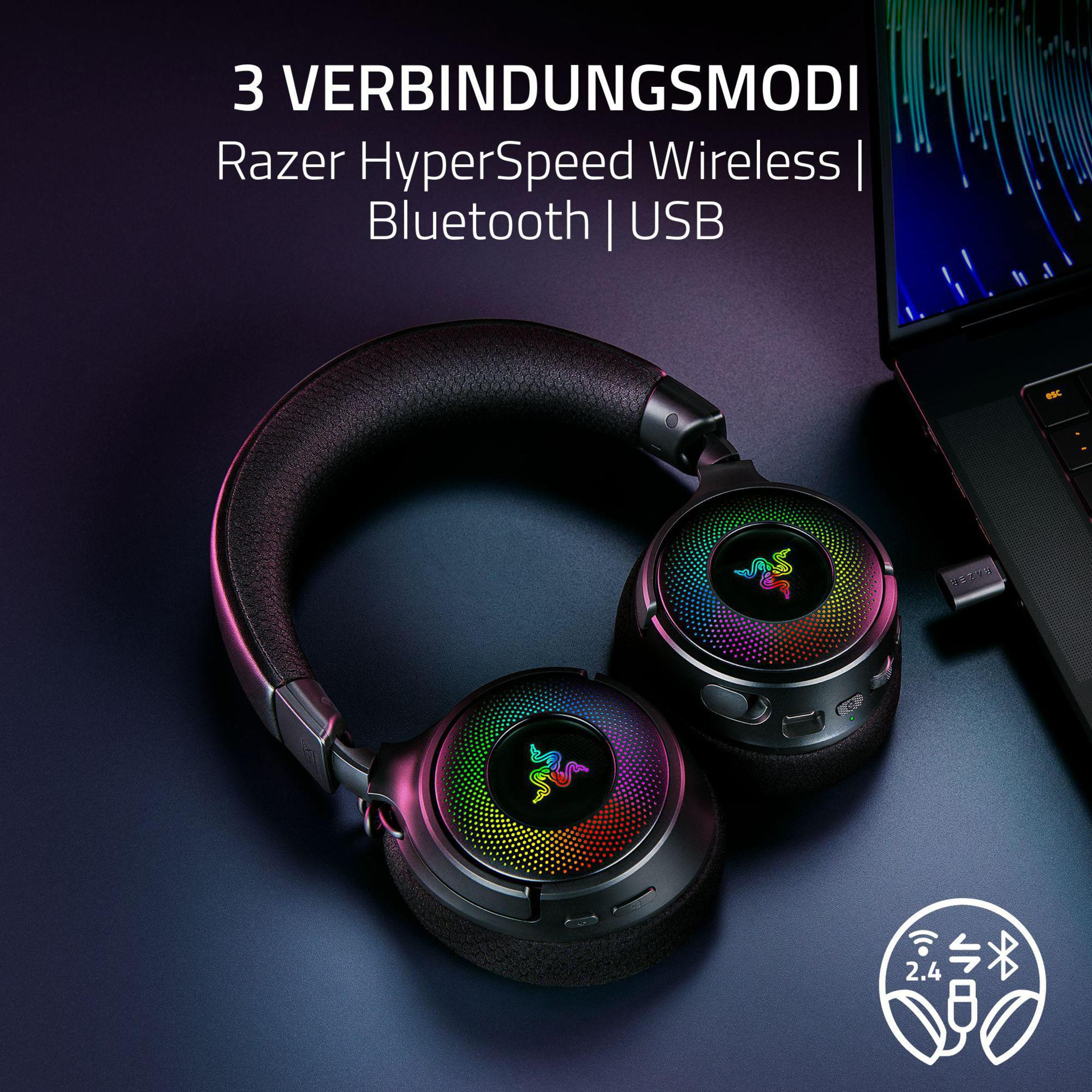 Czarne słuchawki Razer na ciemnej powierzchni z neonami. Tekst: 3 tryby połączenia.