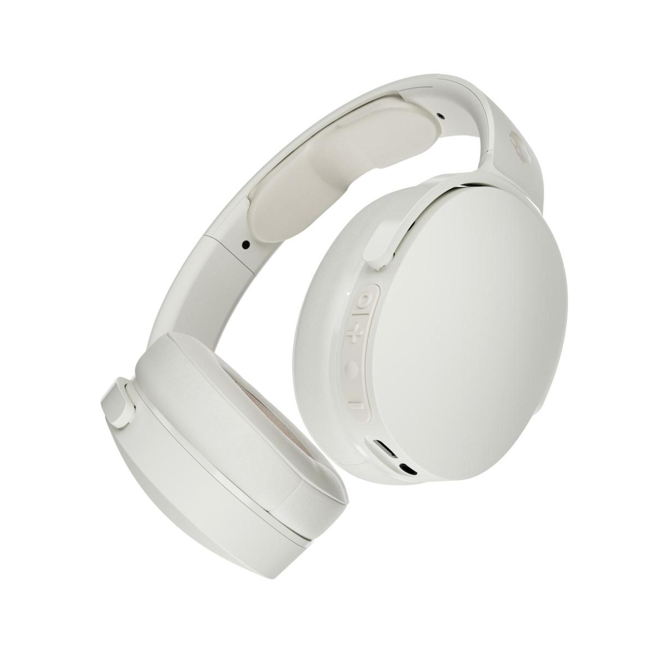 White headphones. The headphones have buttons on the side.