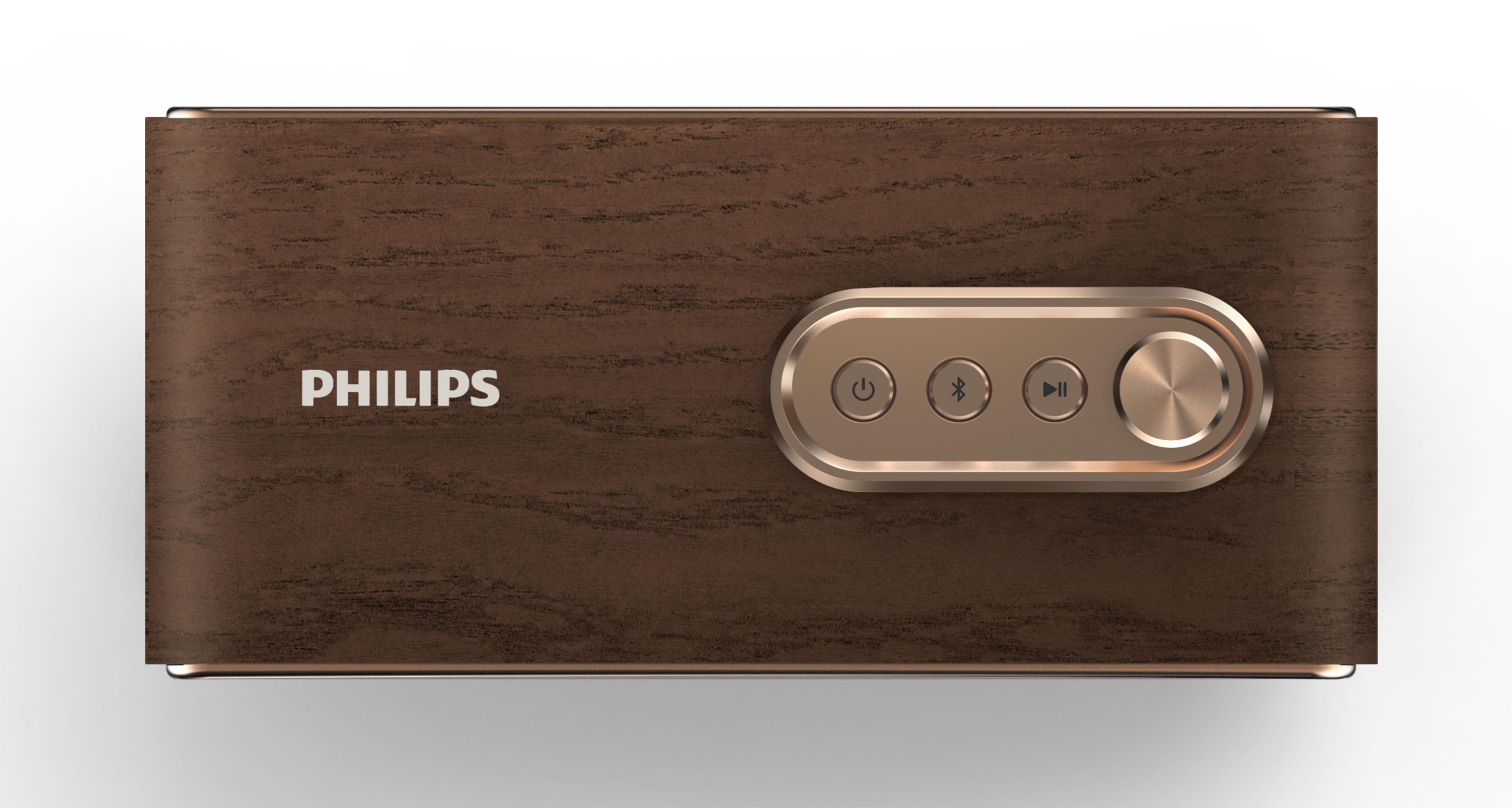 Altın düğmeli kahverengi Philips hoparlör. Hoparlör ahşap benzeri bir dokuya sahip. Beyaz üzerine izole edilmiş.