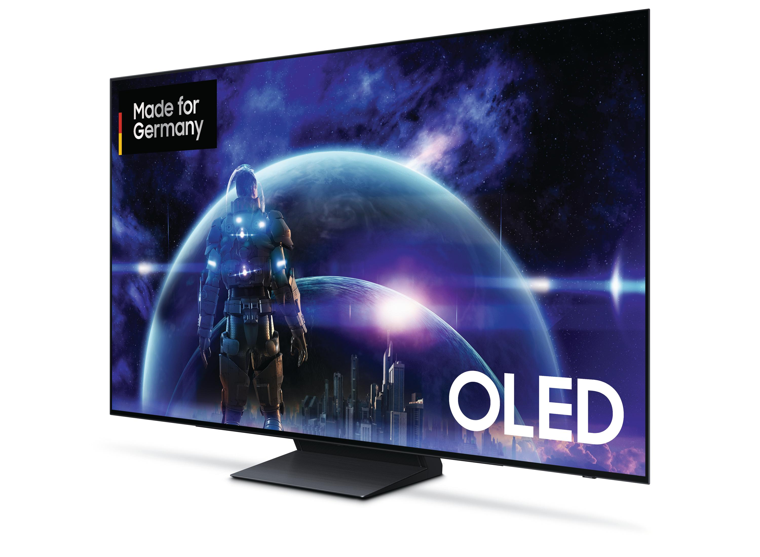 Czarny telewizor z futurystyczną sceną kosmiczną, napis 'OLED'.