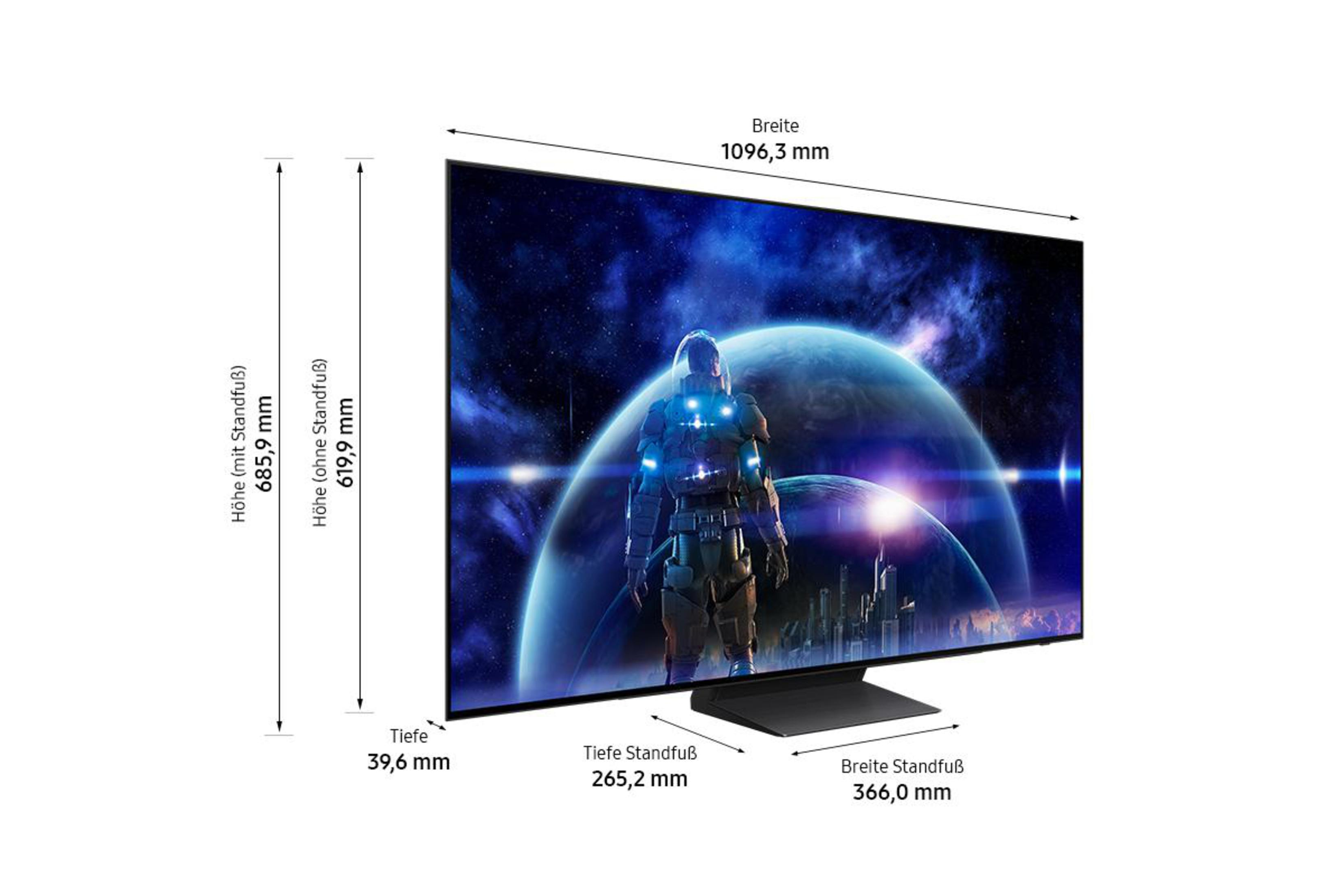 Telewizor z obrazem astronauty na ekranie, wymiary pokazane. Czarny stojak, białe tło.