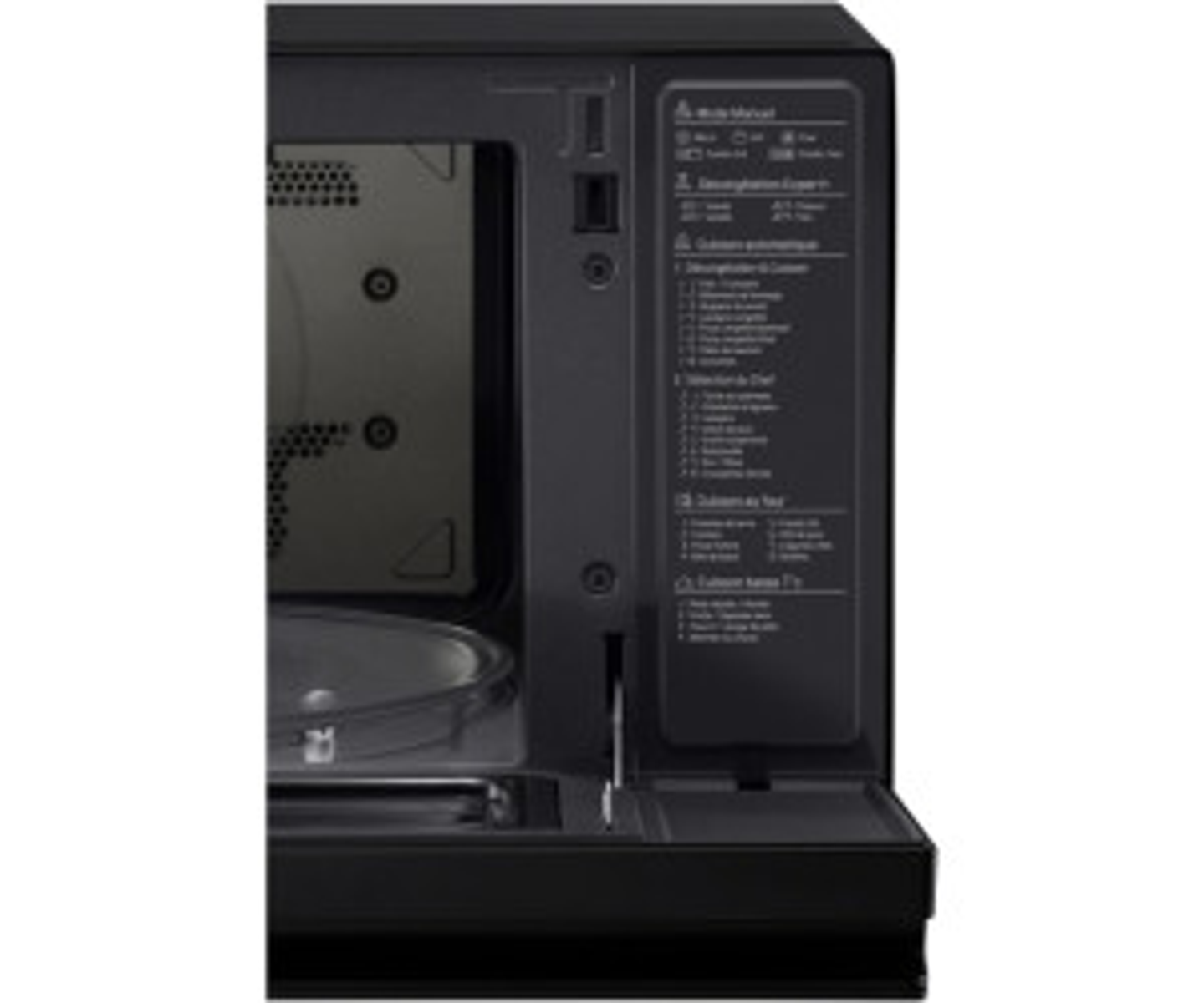 All'interno di un forno a microonde nero, con un pannello di controllo a destra.