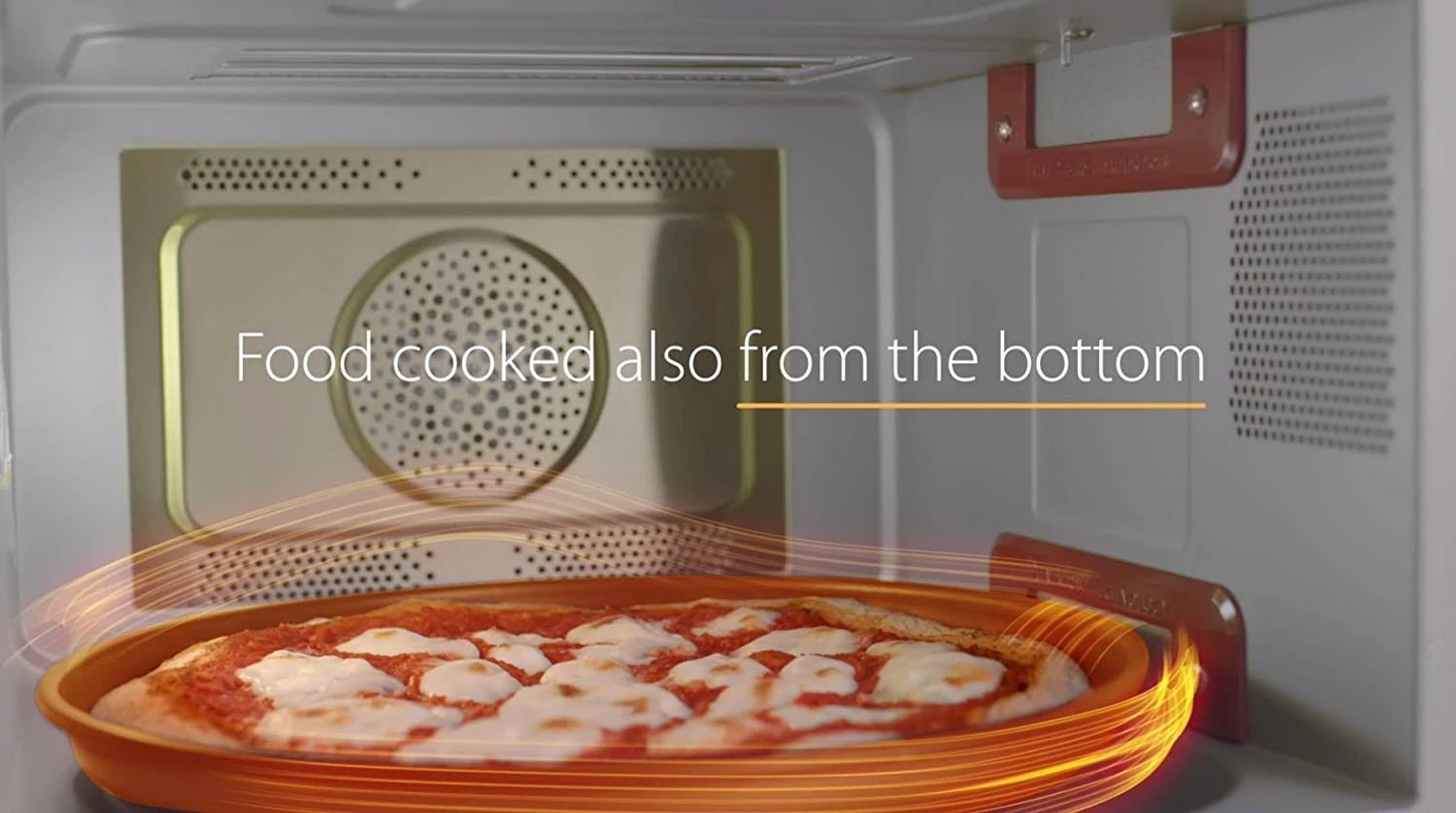 Pizza w kuchence mikrofalowej, ze słowami 'Food cooked also from the bottom' i pomarańczowymi liniami ciepła.