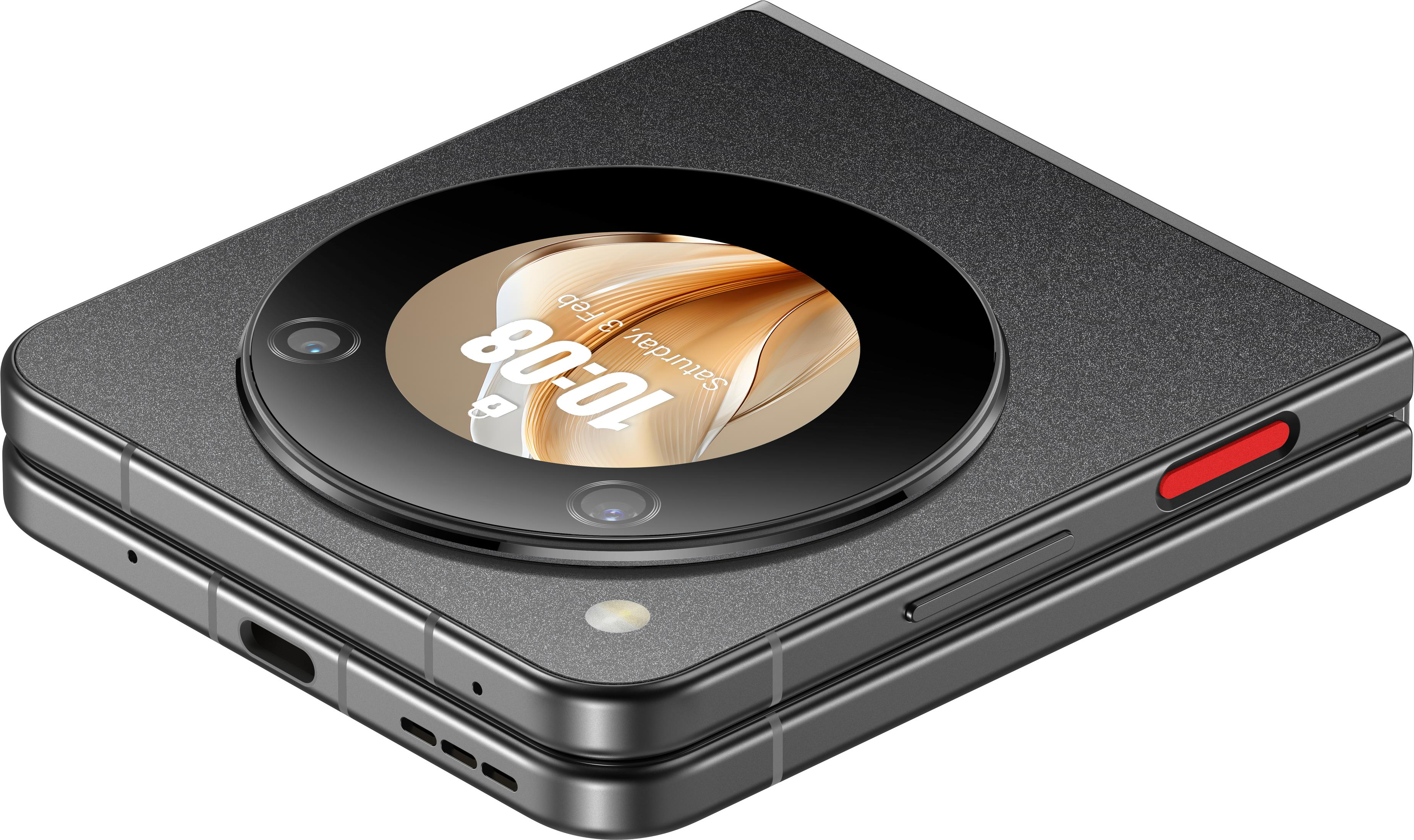 Składany szary telefon pokazujący godzinę, z okrągłym ekranem i czerwonym przyciskiem.