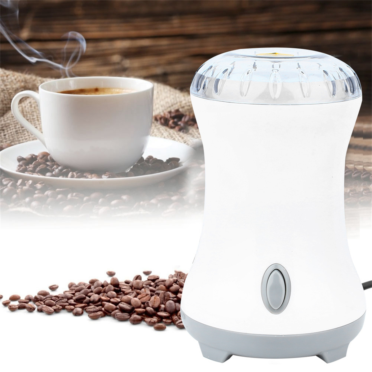 Weiße Kaffeemühle mit Kaffeebohnen und einer Tasse Kaffee. Holziger Hintergrund.