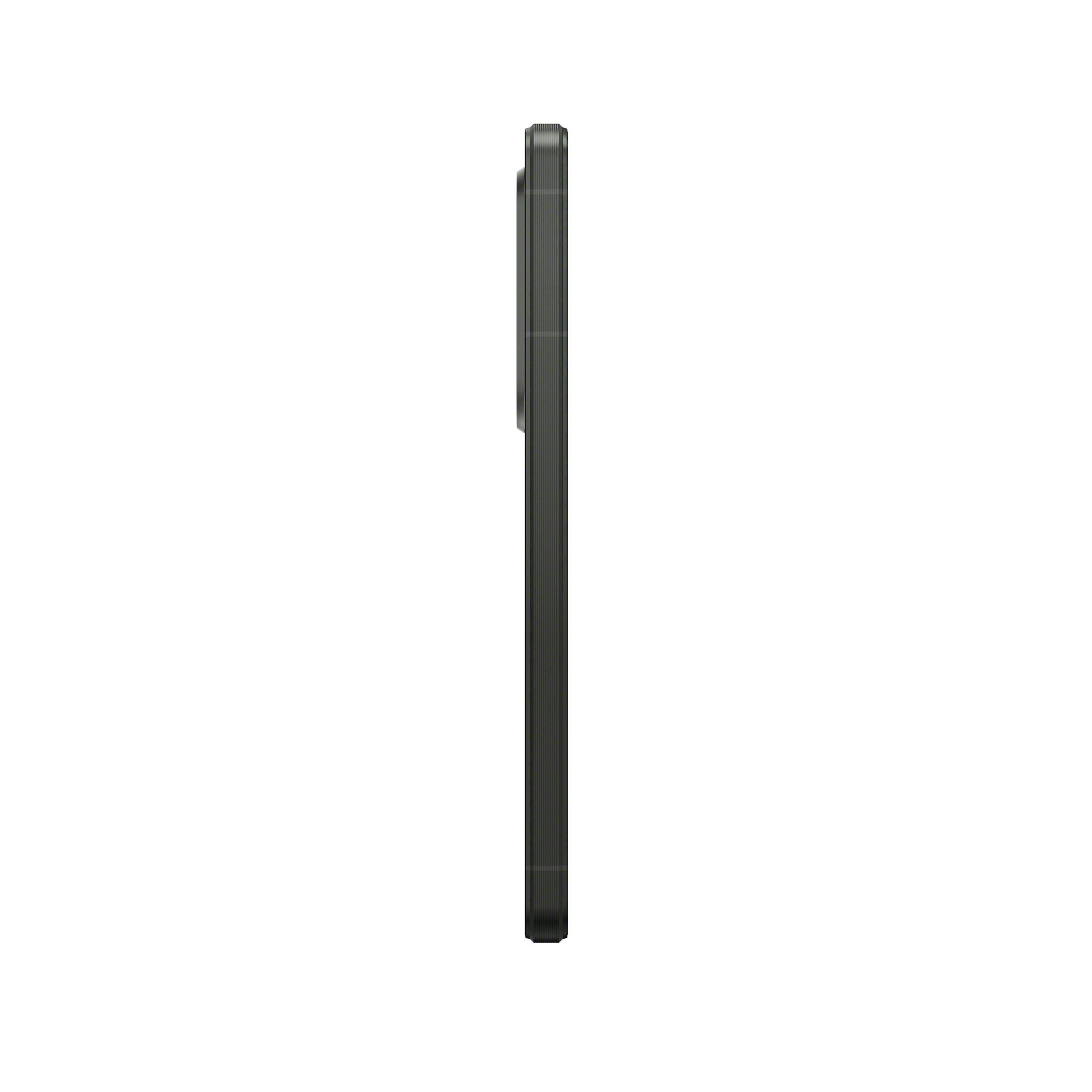 Un smartphone negro de lado sobre un fondo blanco. El teléfono está apagado.