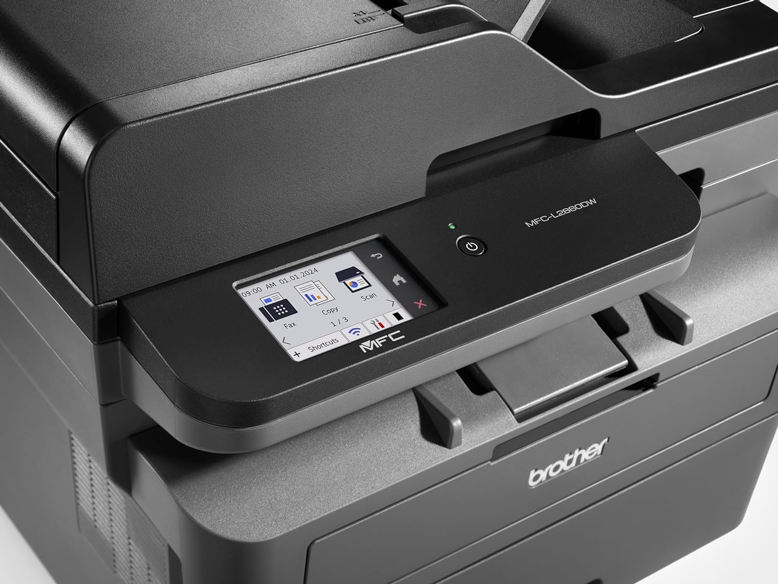 Czarna drukarka Brother z ekranem pokazującym ikony i datę.