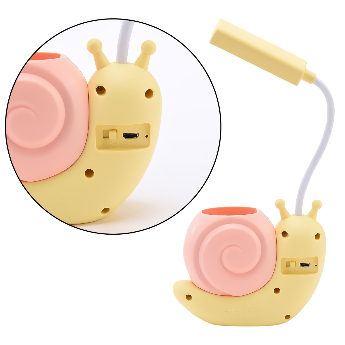 Eine gelbe, schneckenförmige Lampe mit rosa Gehäuse. Sie hat einen USB-Anschluss und Stifthalter.