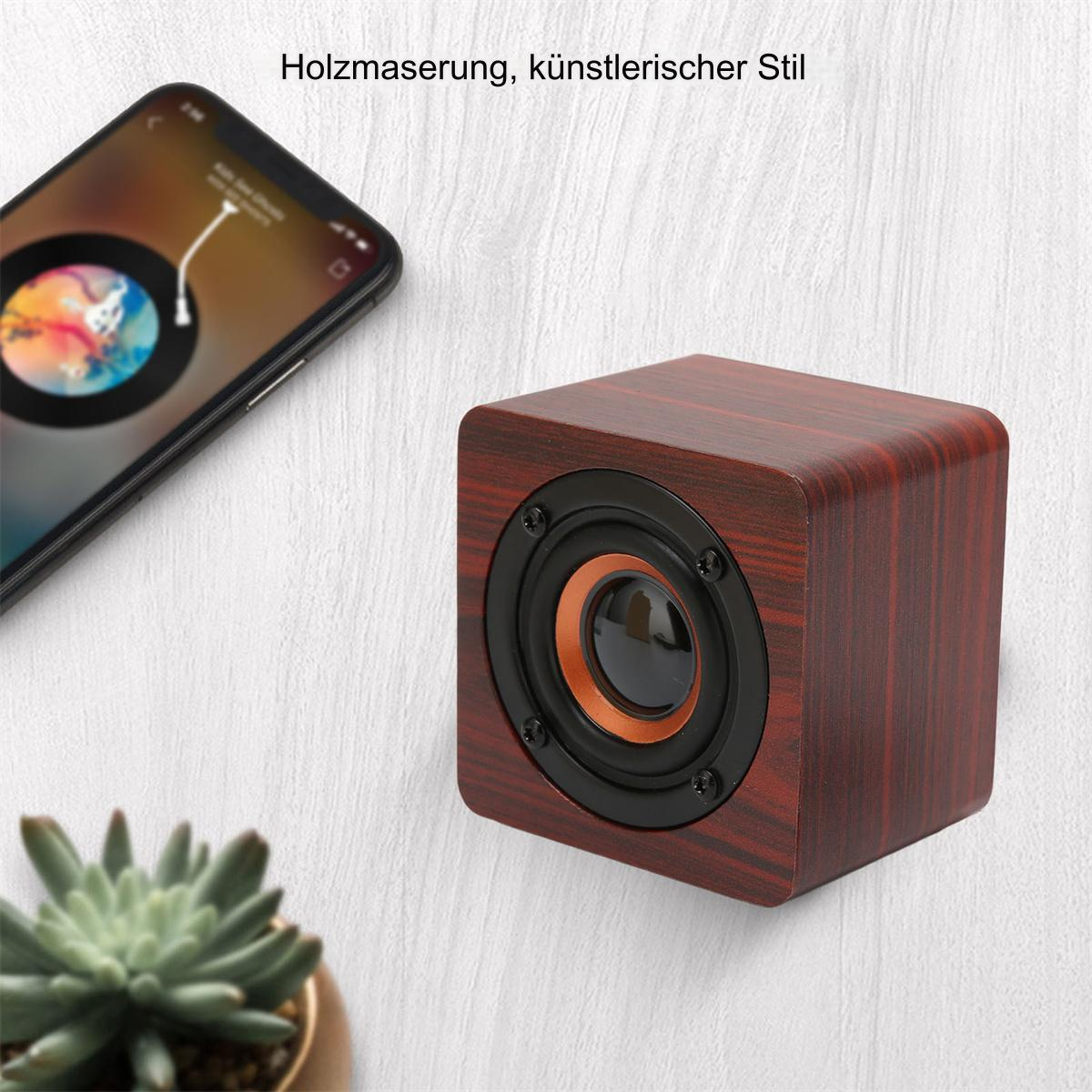 Holzlautsprecher mit Telefon, das Musik zeigt. Der Lautsprecher ist in Wandnähe.