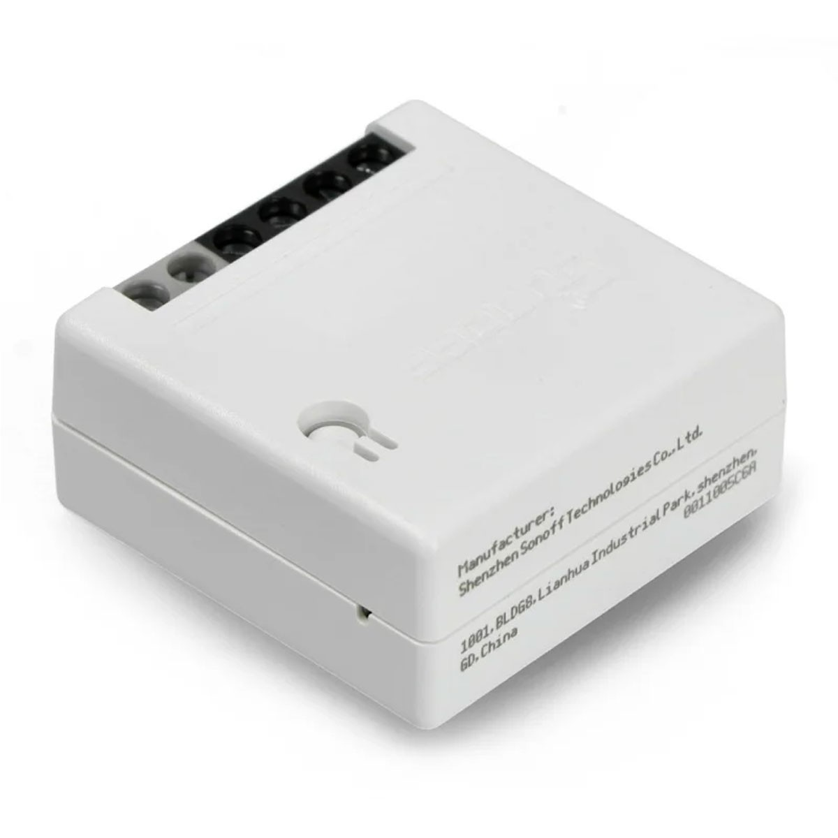 Un dispositivo elettronico bianco, forse un interruttore, con connettori neri e grigi sopra. Testo sul lato.