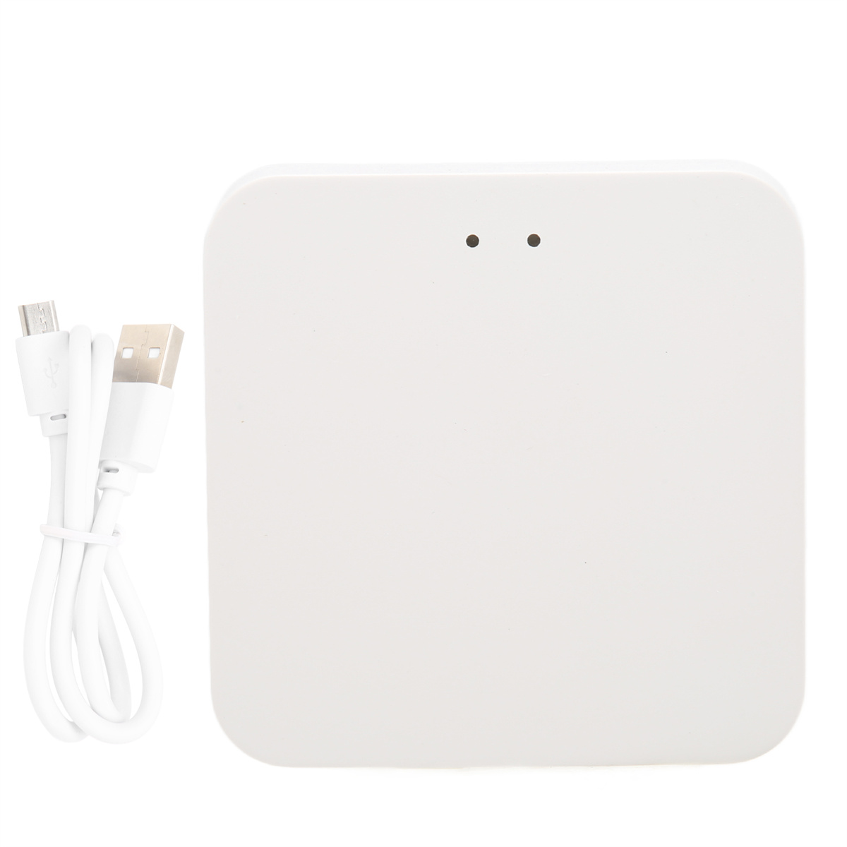 Weißes, quadratisches Gerät mit zwei Punkten, daneben ein USB-Kabel. Schlichter weißer Hintergrund.