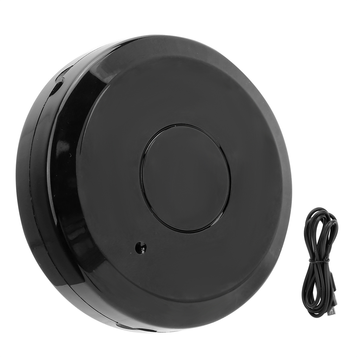 Ein schwarzes, rundes Gerät mit einem kleinen Loch und einem schwarzen Kabel.