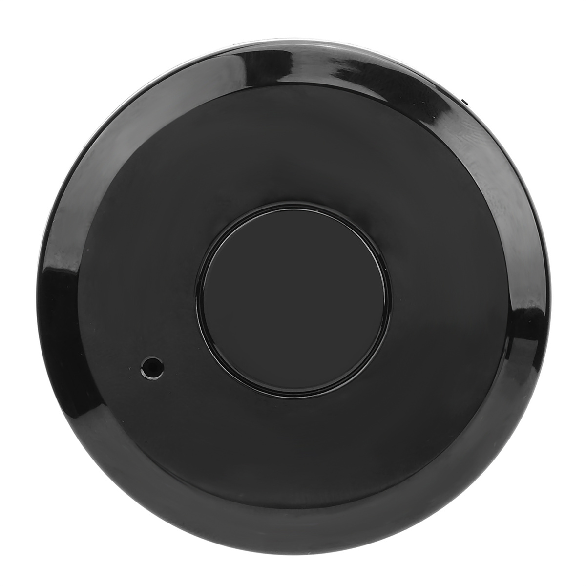 Ein schwarzes, kreisförmiges Gerät mit einem zentralen Kreis, einem kleinen seitlichen Punkt und glänzender Oberfläche.