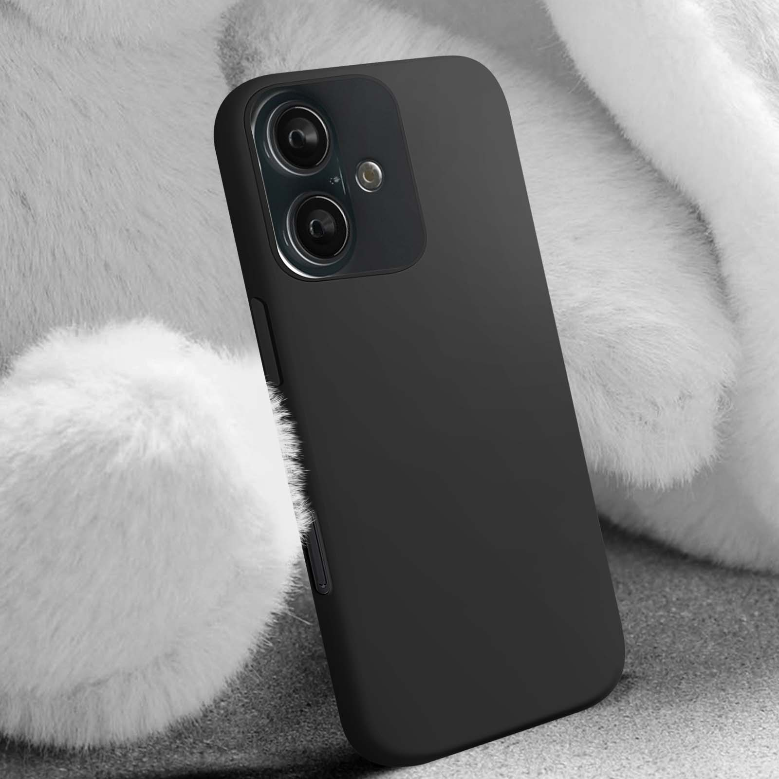 Custodia per telefono nera. Ha un ritaglio per la fotocamera ed è appoggiata su una superficie bianca e soffice.