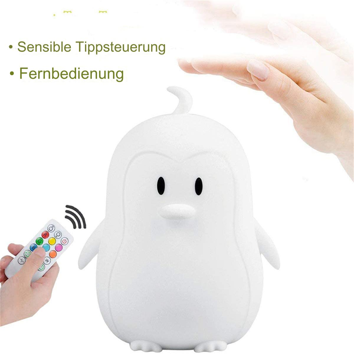 Weiße Pinguin-Lampe mit Fernbedienung. Hand darüber. Text: Empfindliche Spitzensteuerung, Fernbedienung.