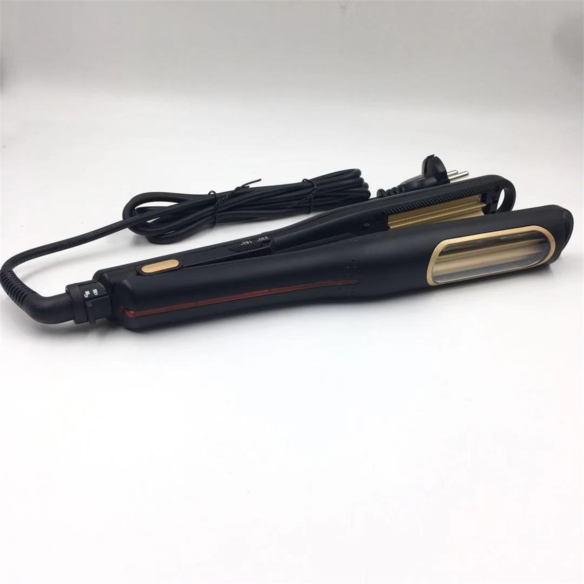 Schwarzer Haarkremper mit schwarzem Kabel. Goldakzente sind vorhanden.