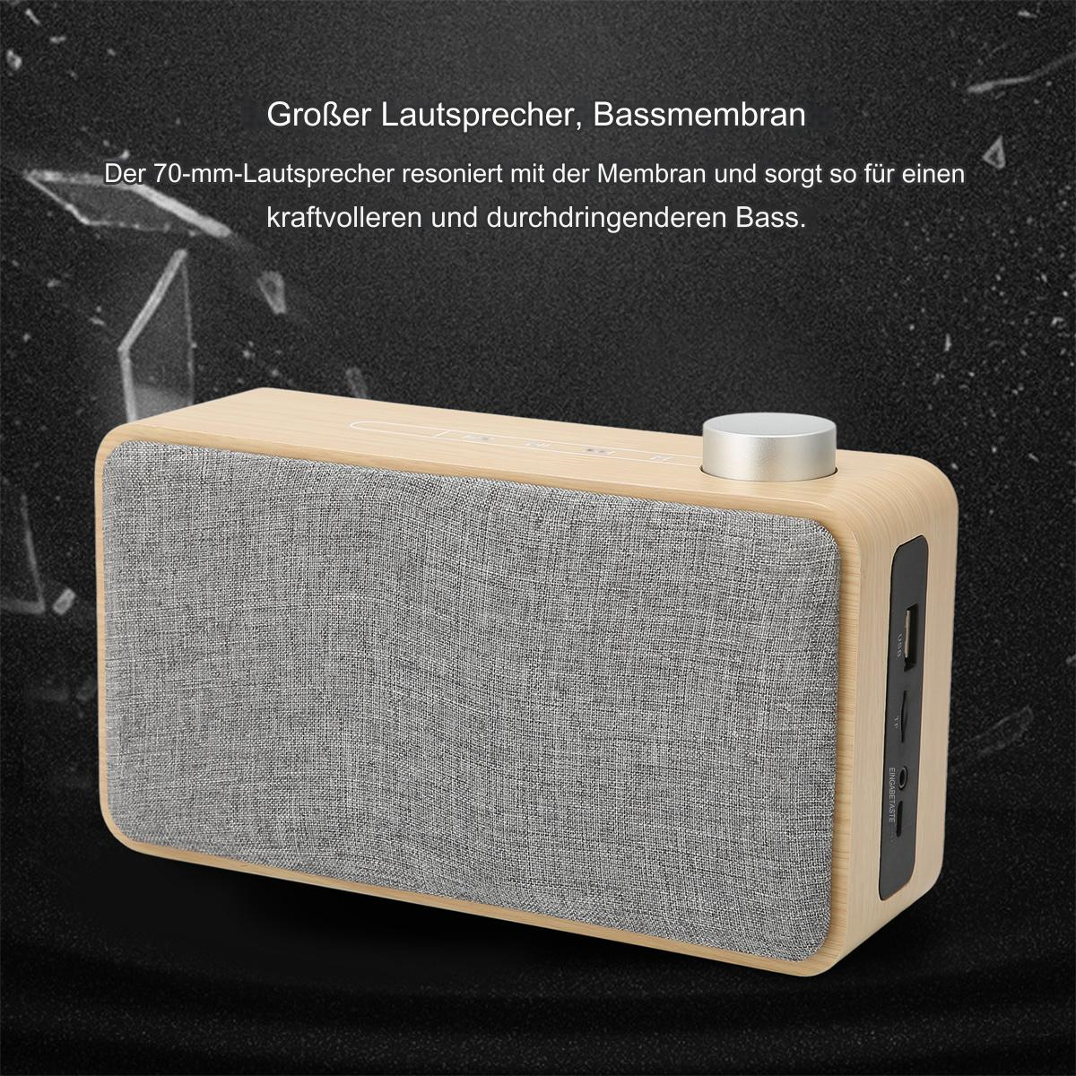 Ein hölzerner Lautsprecher mit grauer Lautsprecherabdeckung. Er hat einen silbernen Knopf und Anschlüsse auf der rechten Seite.