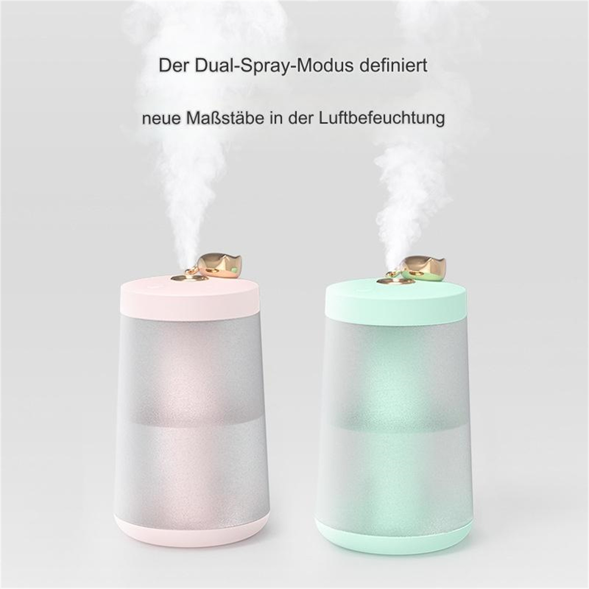 Zwei Luftbefeuchter, rosa und grün, erzeugen Dampf. Text: Dual-Spray-Modus.