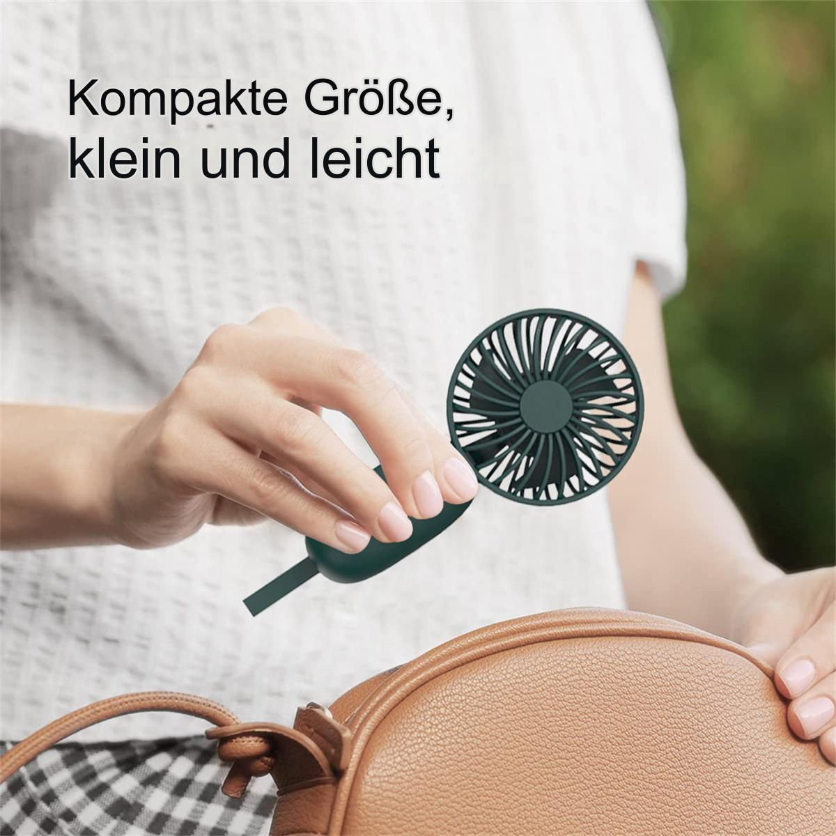 Die Hand einer Frau hält einen kleinen, dunkelgrünen tragbaren Ventilator.