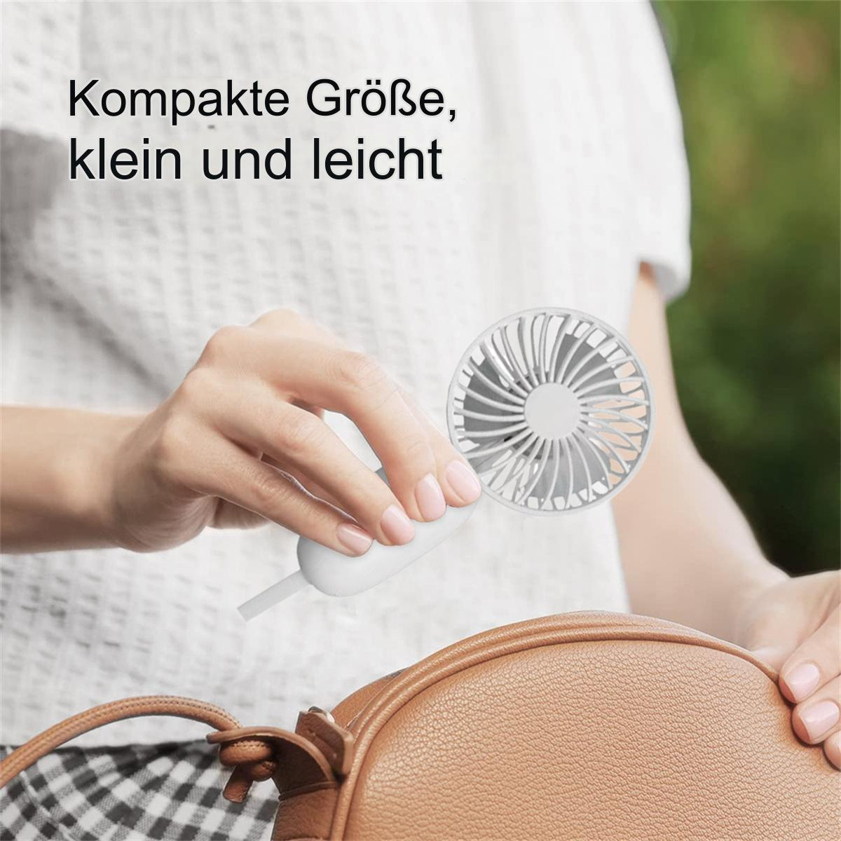 Frau hält einen kleinen, weißen Handventilator. Braune Geldbörse im Hintergrund. Draußen.