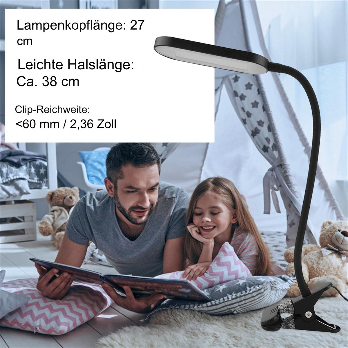 Ein Vater und eine Tochter lesen ein Buch, mit einer schwarzen Lampe an einem Kissen.